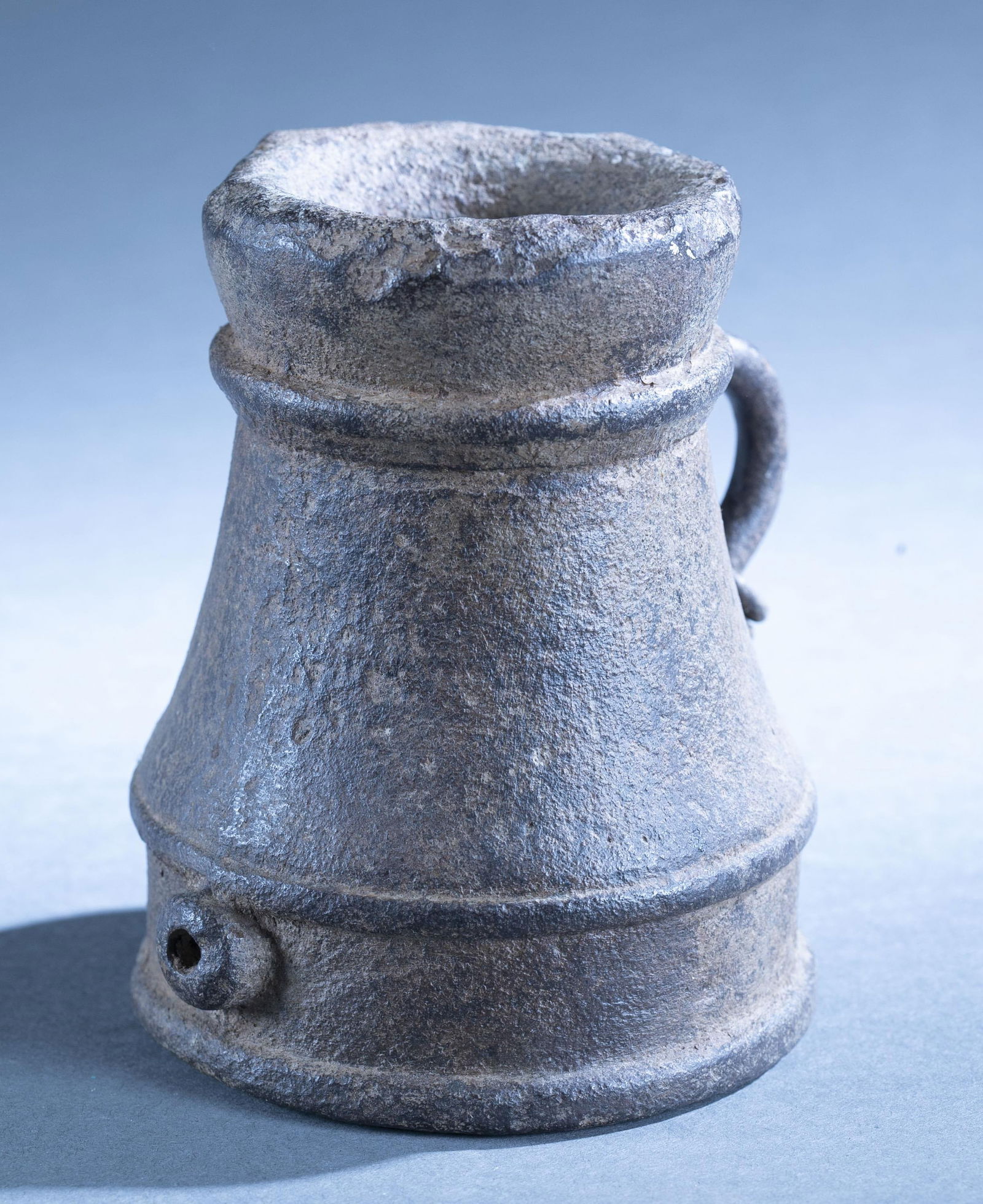 Spanish Colonial "Thunder Mug" signalling cannon: A Spanish Colonial cast bronze "Thunder Mug" signaling or saluting cannon with handle, 17th Century. 6 1/2" x 6" x 5" Condition: Loss on one edge.
