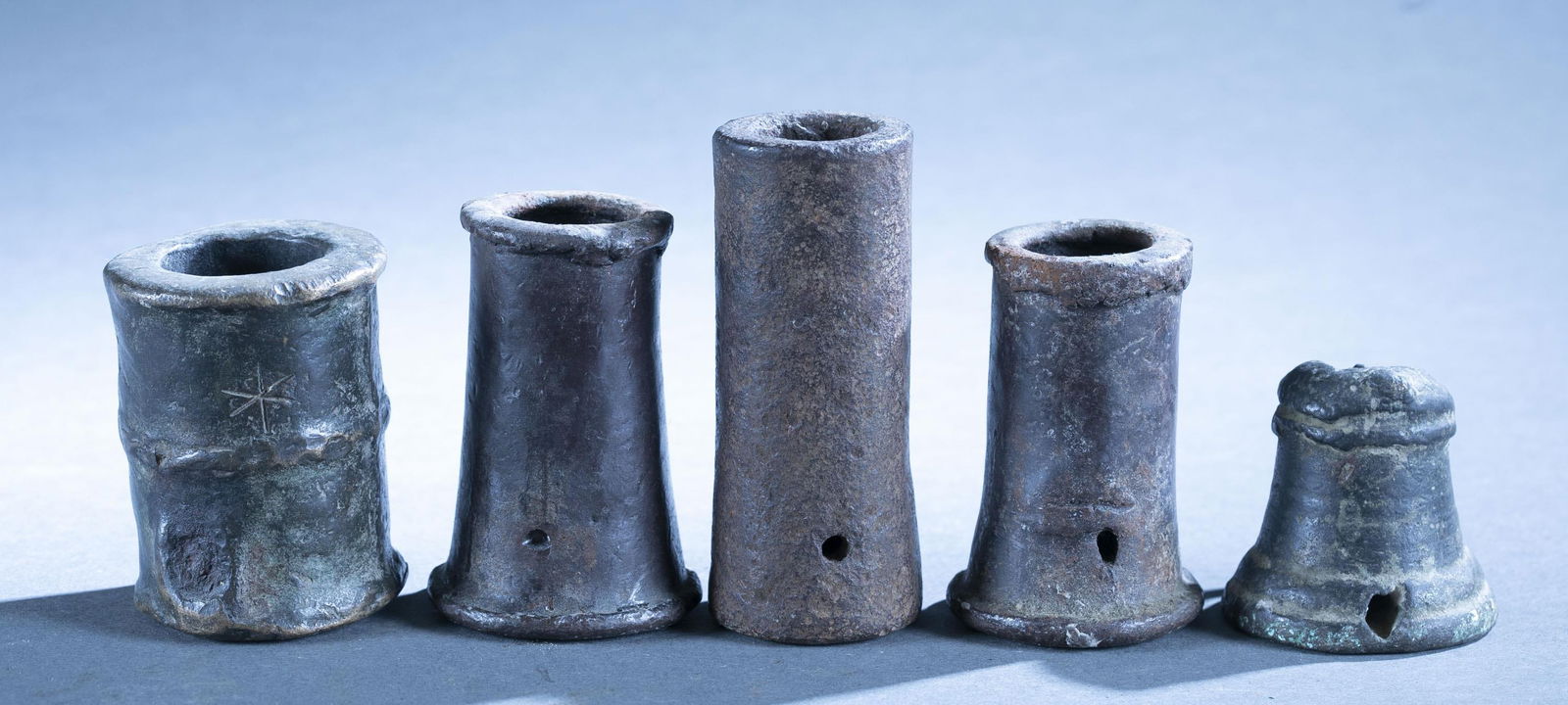 5 Spanish Colonial small signaling cannons.: A group of five Spanish Colonial small signaling, saluting, or powder testers cannon cannons, 17th Century. One "Thunder Mug" type and four cylindrical. Largest: 4 1/4" x 1 3/8" 24mm bore. Smallest: 2