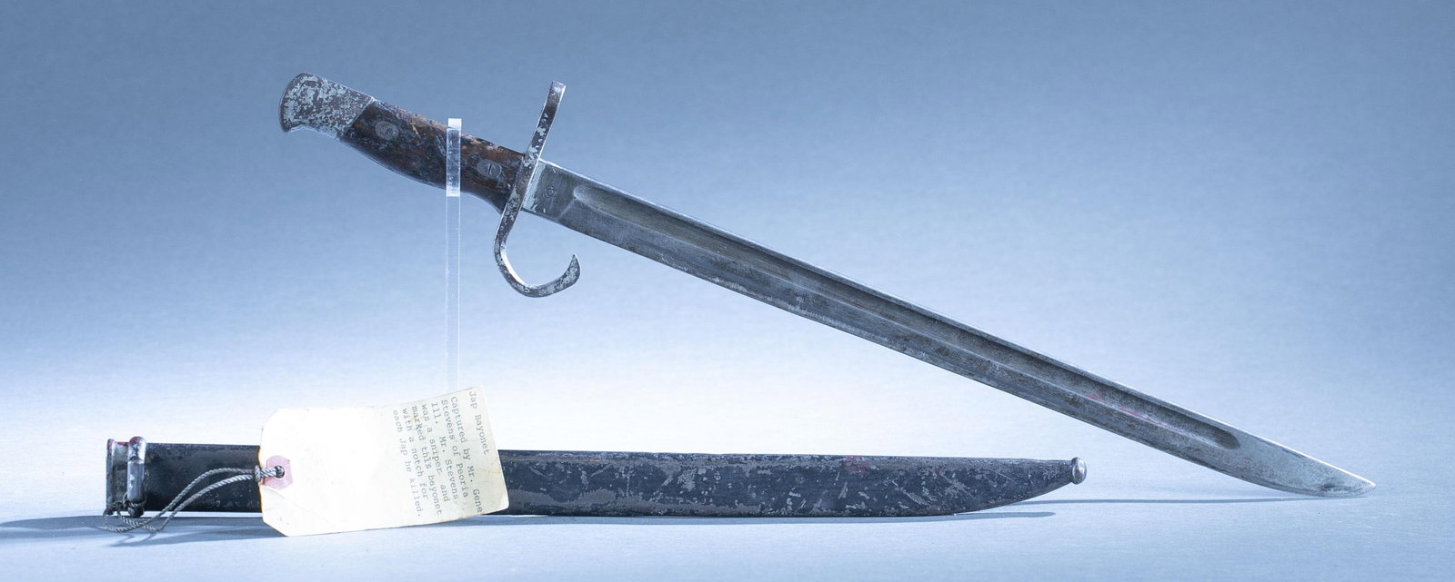 Japanese Type 30 bayonet with scabbard.: A Japanese Type 30 bayonet with scabbard. 15 1/2" blade. Ricaso has Koishikawa Arsenal (Tokyo) or Kokura Arsenal mark. 19 3/4" overall. 16 1/4" scabbard Condition: Notches on grip and painted on scabb
