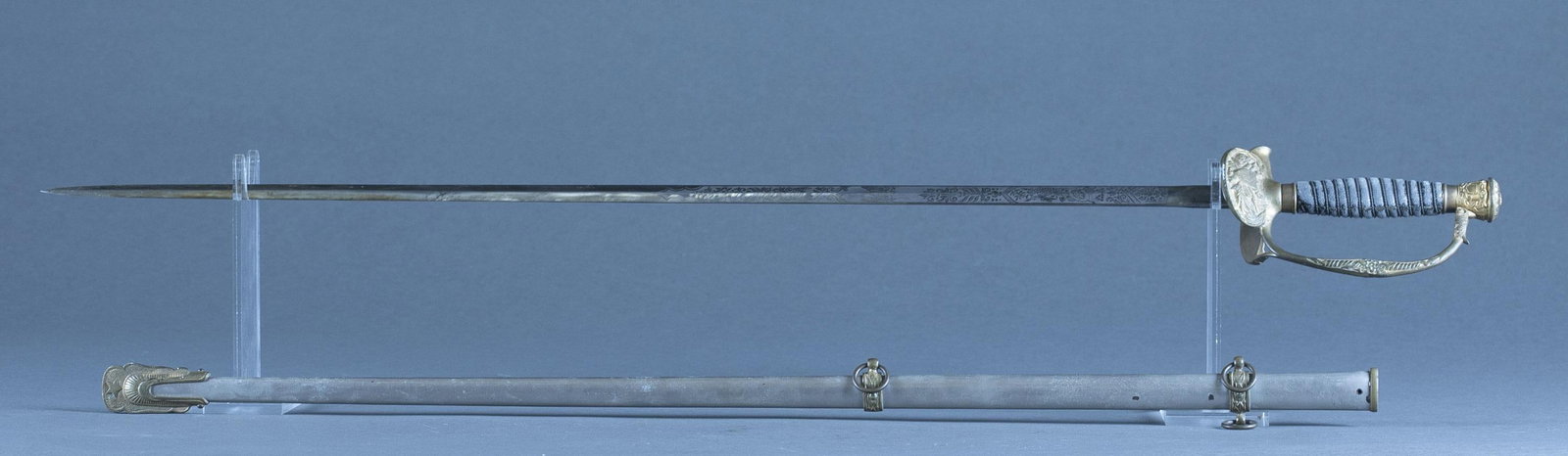 U.S. Staff & Field Officer's M1860 sword: An U.S. Staff & Field Officer's Model 1860 sword with scabbard 30" etched blade. Harvey V. Allen Co. maker mark on ricasso. Brass crossguard with fish skin grip. 36 1/4" overall. 37 1/2" scabbard Prov
