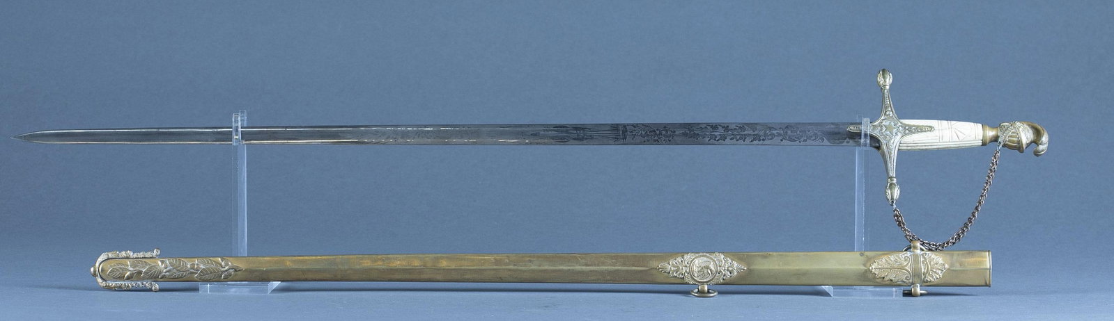 Pre Civil War U.S. Ames Militia Officer's sword: A Pre Civil War U.S. Militia Officer's sword with scabbard by Ames, Chicopee. Circa 1840-1860. 31 1/4" double edged blade. Etched design martial and foliate design. Signed "AMES MFG CO/ CHICOPEE/ MAS.