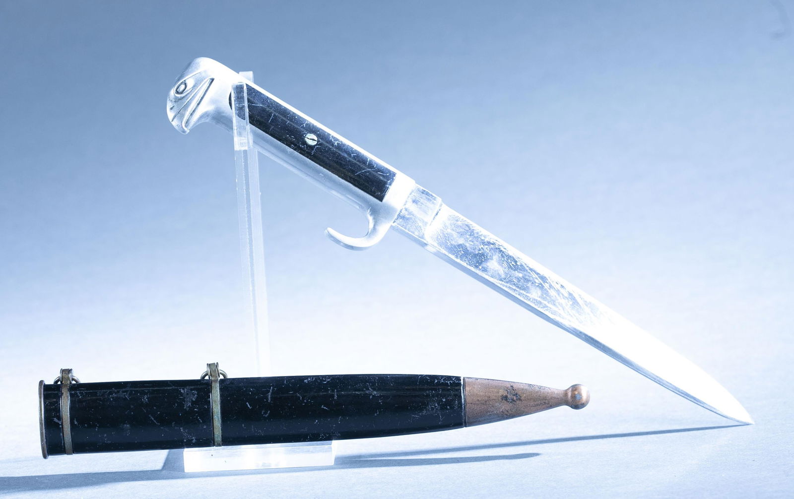 WWII Italian M.V.S.N. M1937 Fascist Leader dagger: A WWII Italian M.V.S.N. "Blackshirts" Model 1937 Fascist Leader dagger. 7" blade with clip point. Metal grip with enamel panels with fasces and eagle head pommel. Brass mount scabbard. 11 1/2" overall