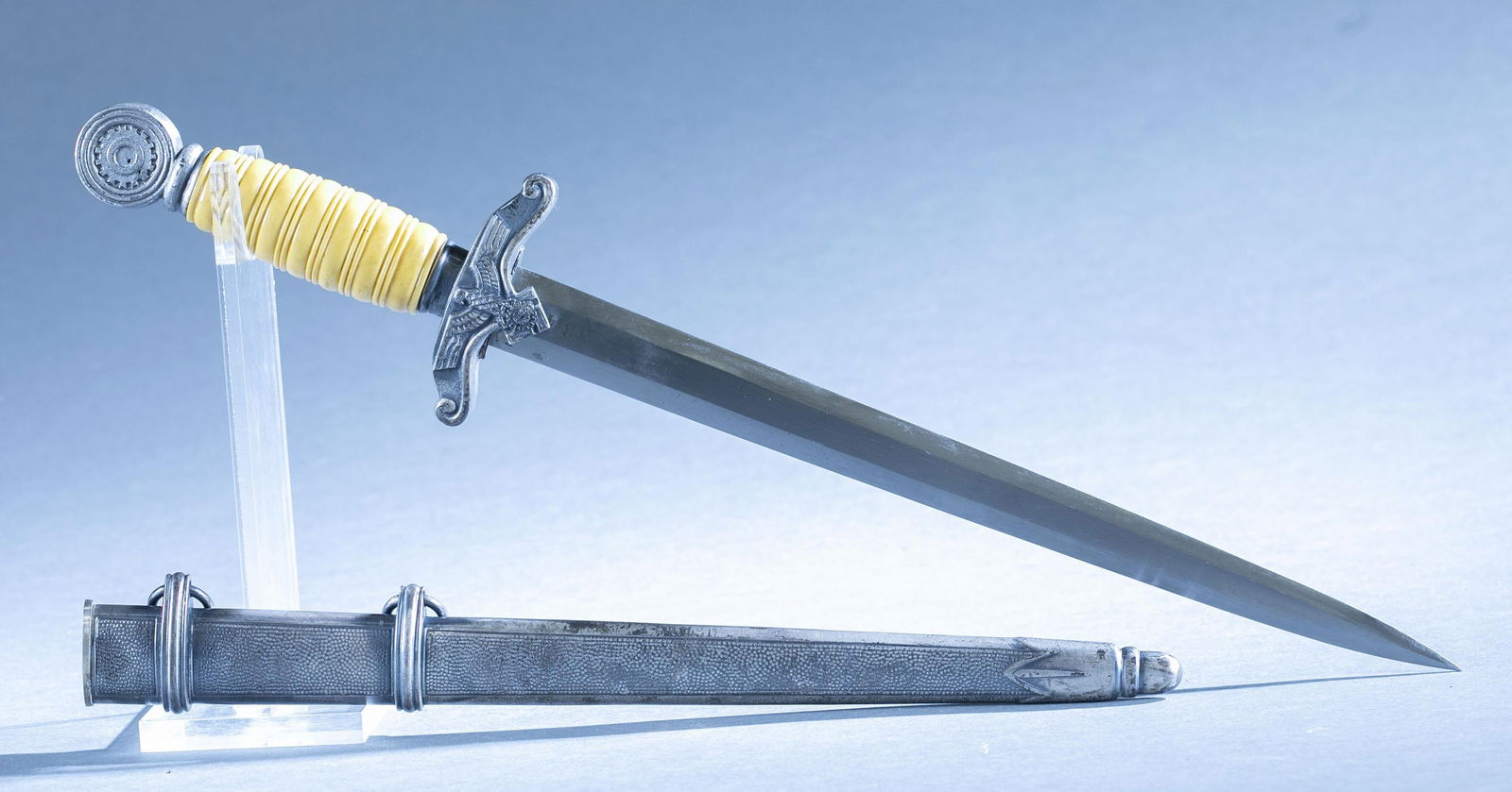 WWII German M1938 TeNo Leader's replica dagger: A WWII German Model 1938 Technische Nothilfe (Technical Emergency Corps) Leader's replica dagger with scabbard. 11 1/4" double edged blade. Blade serial marked with raised "3345" and eagle with swasti