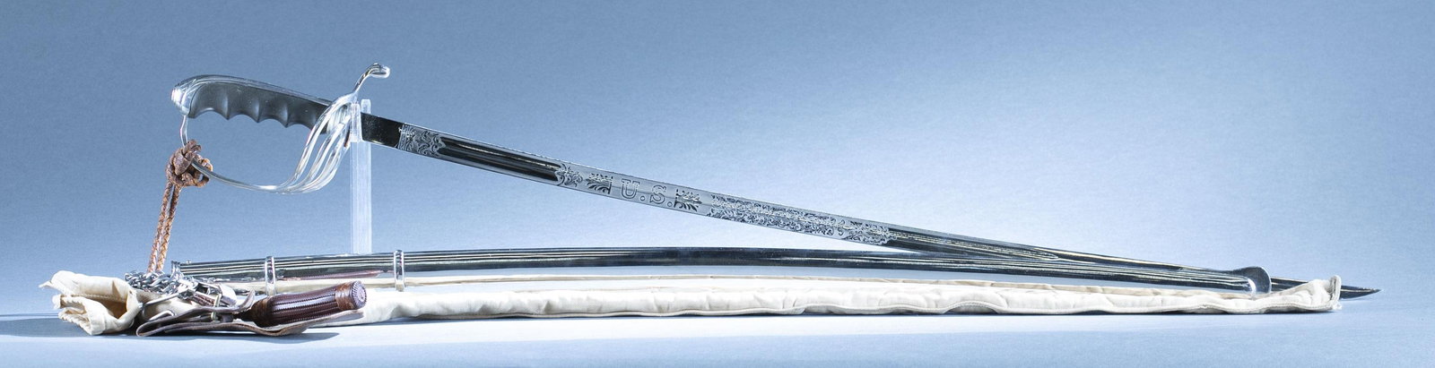 U.S. M1902 Army Officer's saber and scabbard: An U.S. Model 1902 Army Officer's saber, scabbard, frog and canvas cover. 32" single edged blade. 37 1/2" overall and 33 1/4" scabbard