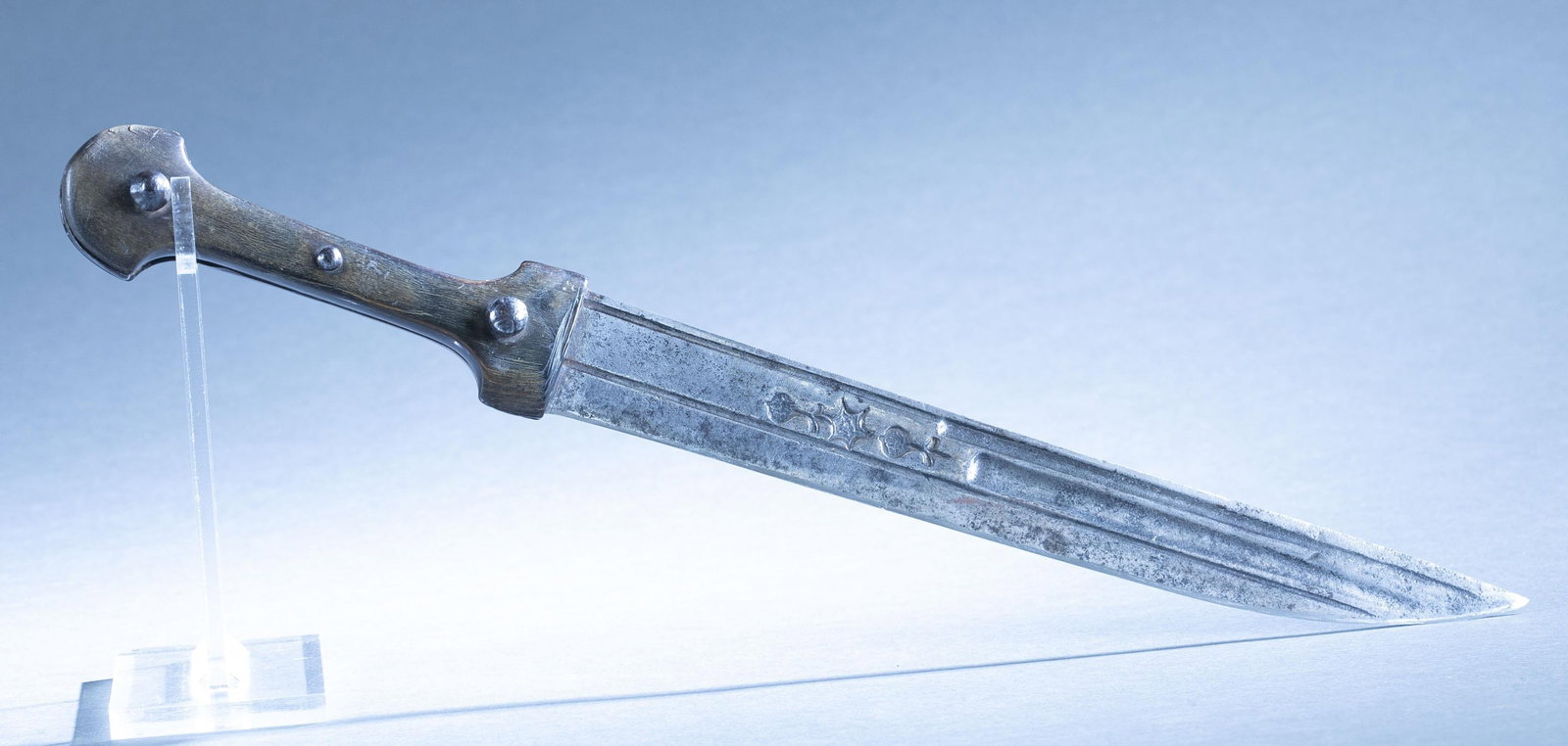 Ottoman Afyon Dagger: An Ottoman Afyon Janbiya (Jambiya) dagger, 19th century. 12" single edged blade with stamped geometric shapes. Horn grip. 18" overall.