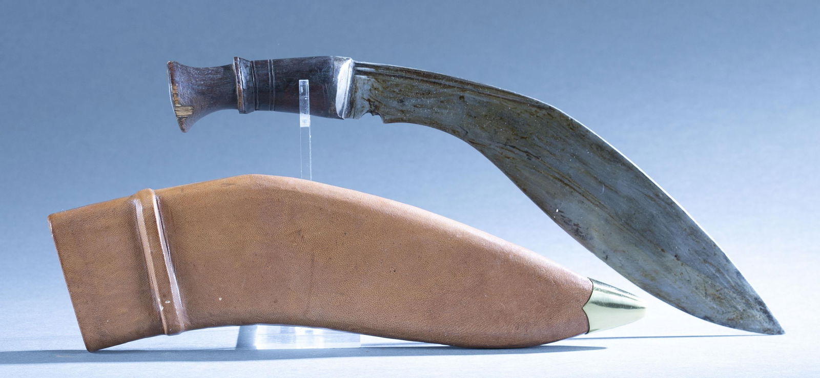 Napalese kukri knife with scabbard: A Napalese Kukri Khukuri knife with sheath. 12 broad leaf blade. Wood grip. Leather scabbard. 16" overall. 14" scabbard.