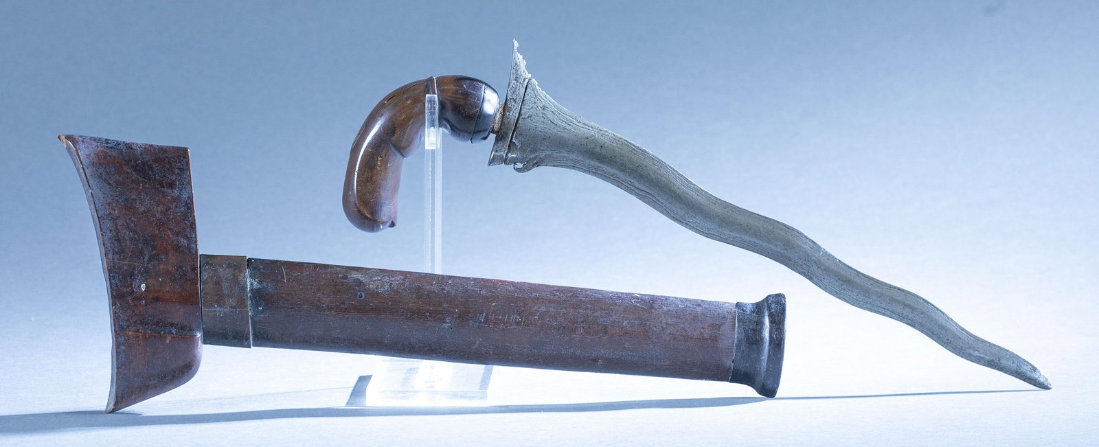 Indonesian keris sword with scabbard: A Indonesian Bugis keris sword with scabbard. Wood grip. 13" blade. Wood ukiran hilt. Wood scabbard. 15 1/2" overall. 15" scabbard