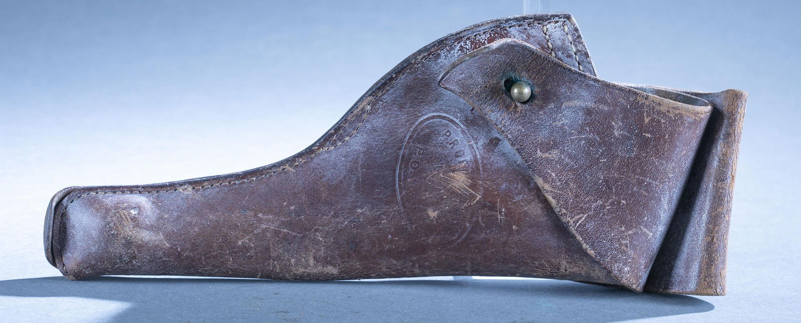 U.S. Post Office M1917 revolver holster: An U.S. Post Office Colt and Smith and Wesson Model 1917 revolver holster. Stamped on front date 1949 and "PROPERTY OF/ U.S./ P.O. DEPT." No maker marks. Condition: Stamp worn.