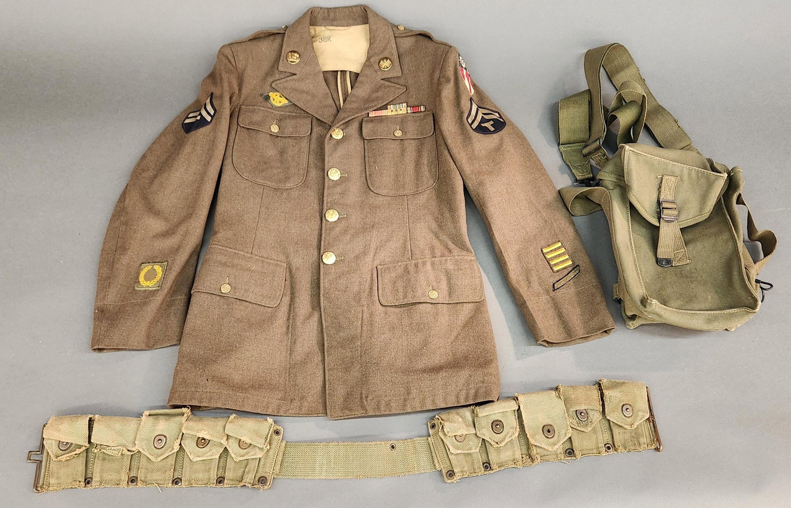 WWII USAAC CBI wool dress jacket: A WWII U.S. Army Air Corps China Burma India theater wool dress jacket. Technician 5th grade rank badges, CBI patch, 4 overseas bars, Size 38R. Includes M1923 Cartridge Belt and M1 General Purpose Amm