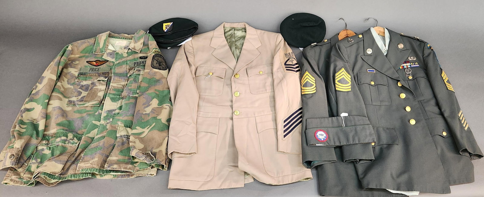 WWII & Cold War U.S. uniforms: A group of WWII & Cold War U.S. uniforms. ++ Two Special Forces Airborne coats and black berets named to Robert William Stuckey Sr. a Special Forces NCO (Master Sergeant). Circa 1970s-1980s. ++ Camouf