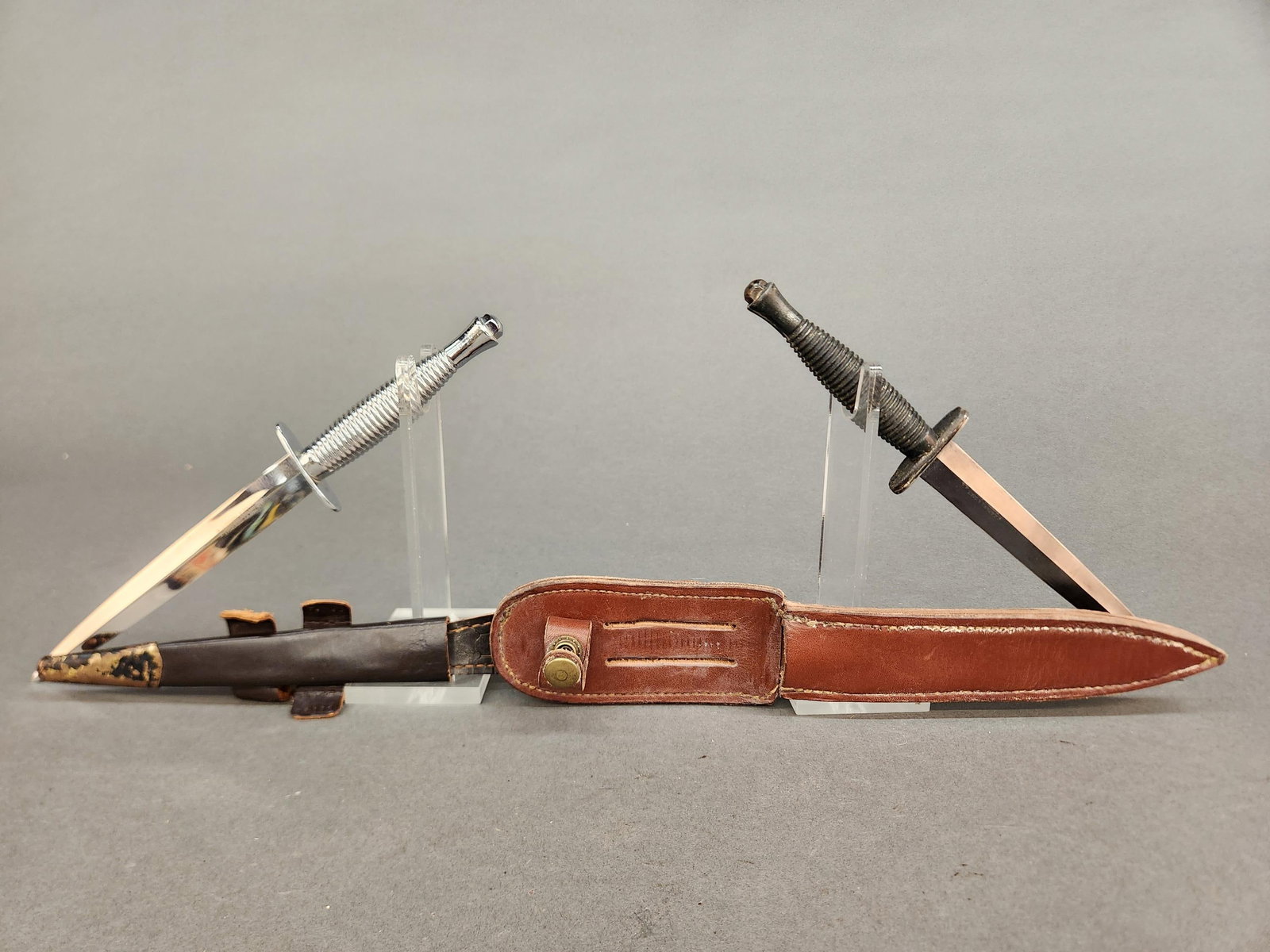 2 British J. Nowill P-3 Fairbairn Sykes knives: A group of two British J. Nowill and Sons, Sheffield Pattern 3 Fairbairn Sykes fighting knives with sheathes.11 1/2" overall.