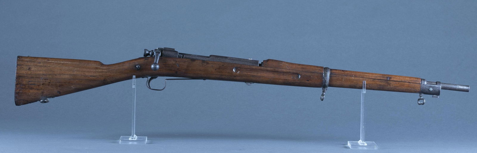 Vintage M1903 Springfield drill rifle: A vintage Model 1903 Springfield drill rifle. Unmarked. 43" overall. Condition: Pitting on metal. Graffiti on stock.