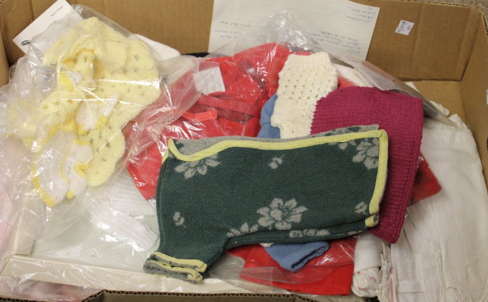 Lot of seasonal doll clothes & doll bedding.: Lot of seasonal doll clothes & doll bedding.Incl crocheted sweaters, swimsuit, corduroy set, crocheted blankets, doll quilts, pillows.