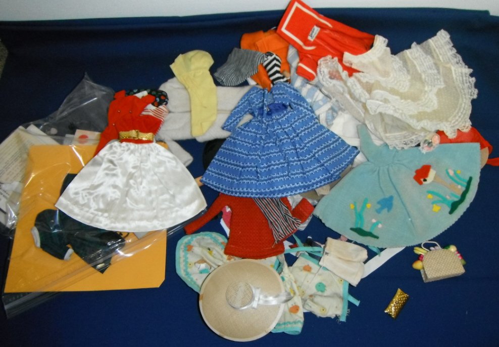 Barbie lot of clothing and accessories.: Barbie lot of clothing and accessories.Lot of Barbie clothing and accessories. Lot includes, jackets, dresses, aprons, pants, shorts, Ken sweater, hats, shoes, purses, jewelry.