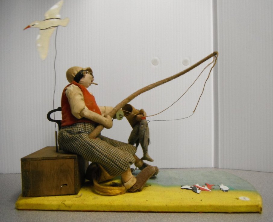 Automaton fisherman doll with fish & seagull.: Automaton fisherman doll with fish & seagull.Wind up doll.