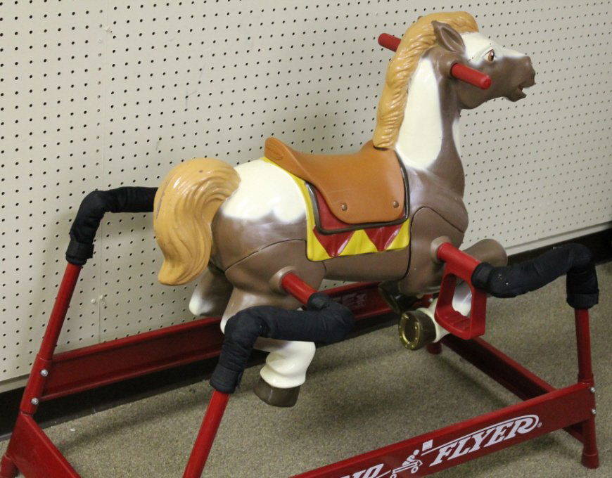 2125 Radio Flyer hobby horse on red stand.