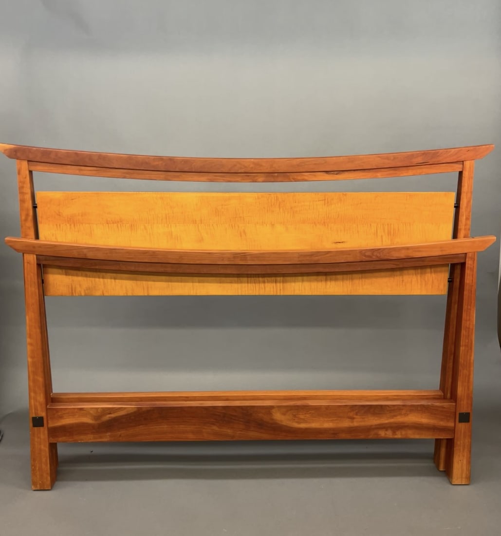 Thos. Moser walnut American Bungalow bed.: A Thos. Moser walnut American Bungalow queen bed. Designed by David Moser and Tom Moser. Signed and dated 2004 on headboard. 50" x 68" x 86". Includes slats and rails. Missing hardware.