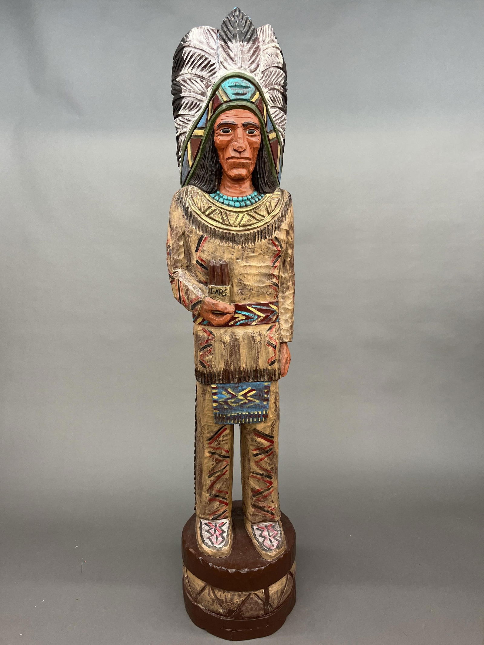 J. Gallagher, Cigar Store Indian chief.: A J. Gallagher cigar store Indian chief. Painted and carved wood. Signature carved into right side. 73" x 15".