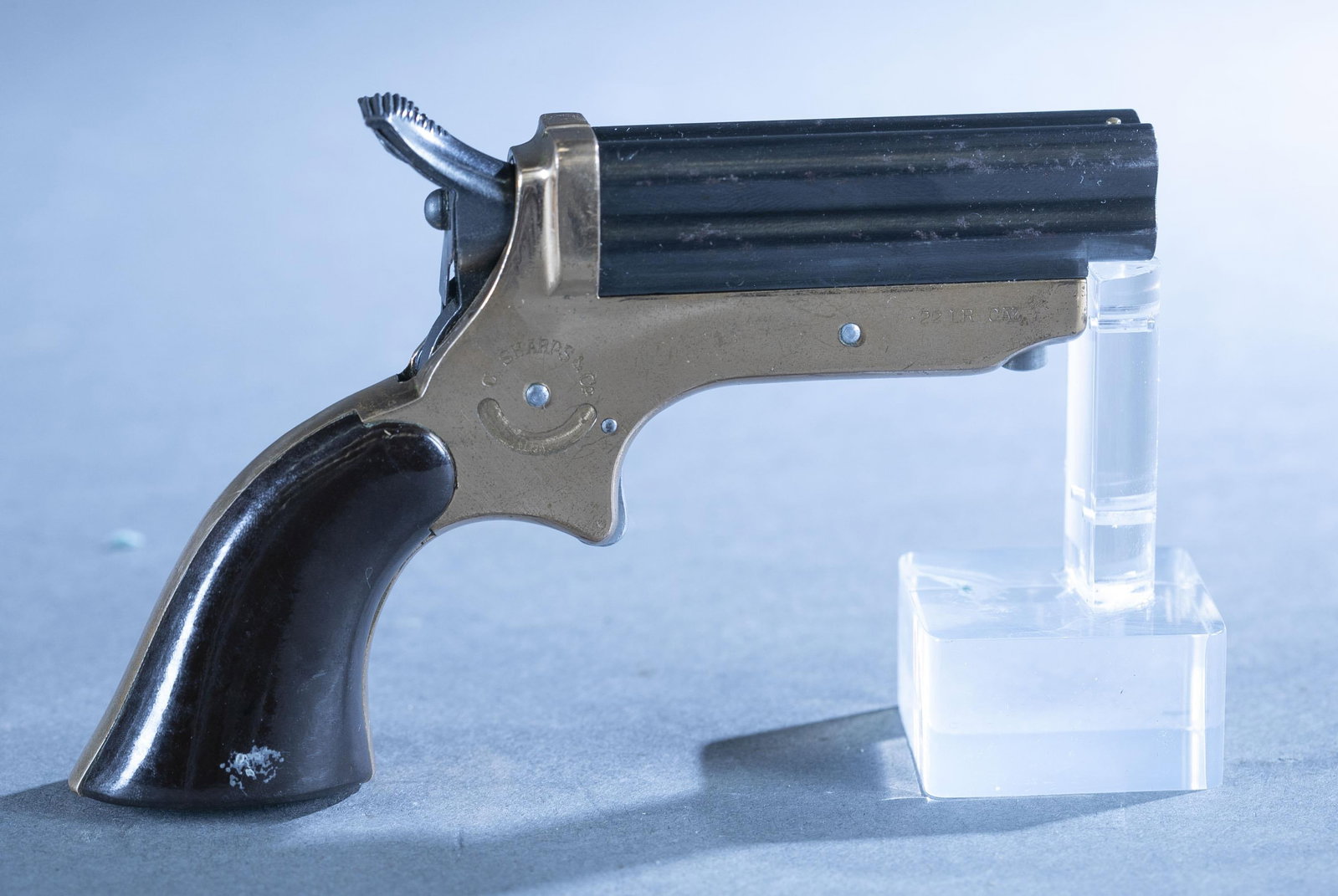Miroku Sharps reproduction pepperbox, .22 LR.: A Miroku, Japan Sharps pepperbox reproduction, .22 LR. Blued finish. Brass frame. 2 1/2" barrel. Wood grips. Serial 30**.Good condition. Spots of oxidation. 88% of original finish. Flaking finish and 