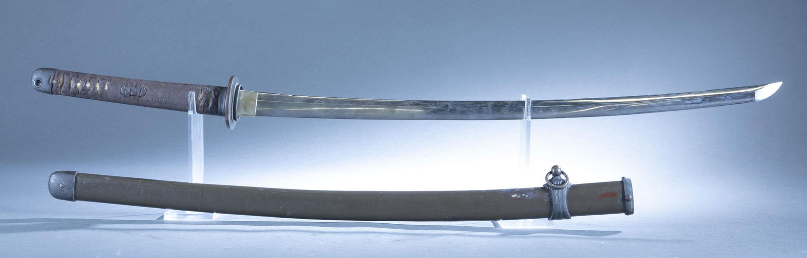 WWII Japanese Type 98 shin gunto sword.: A WWII Japanese Type 98 shin gunto sword. 26" blade signed on tang. Brass habaki and black matte finished bronze tsuba with bronze fuchi, menuki, and kashira. Ray skin grip. Painted metal over wood sc