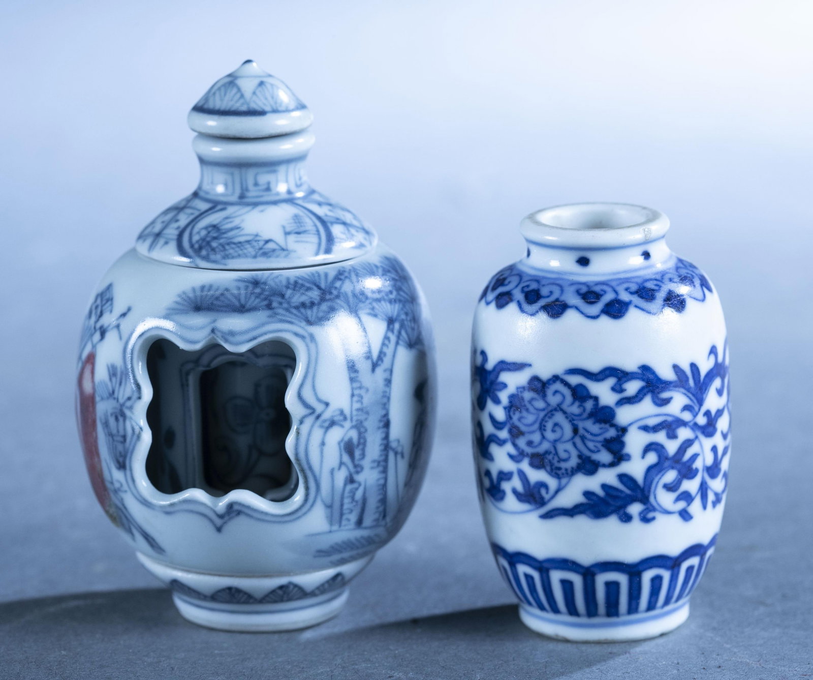 2 Chinese blue and white porcelain pieces.: A group of two Chinese blue and white porcelain pieces. ++ Revolving snuff bottle. Marked on bottom. 3" x 2". ++ Small vase. Marked on bottom. 2.1" x 1.3".