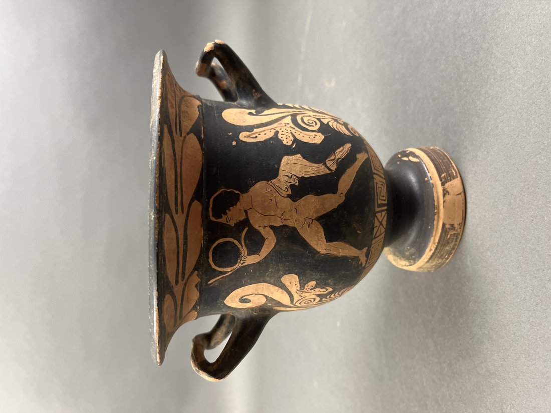 Red-figure bell krater, circa 4th c. BCE.: A red-figure bell krater decorated with a male and female figure on black ground. Circa 4th century BCE. Includes COA from Ancient and Oriental Ltd and a French export document from 2001. 7 1/2" x 8".