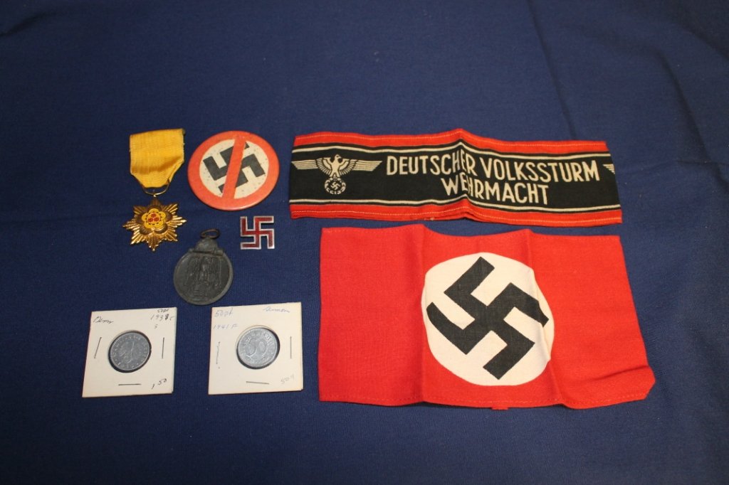 Asst WWII Axis Powers items incl Nazi swastika arm: armband, Deutscher Volkssturm Wehrmacht armband, Nazi coins, Japanese medal, Nazi Germany Russian front medal marked "Winterschlacht im osten 1941/42", red enamel Nazi swastika pin of sterling silver.