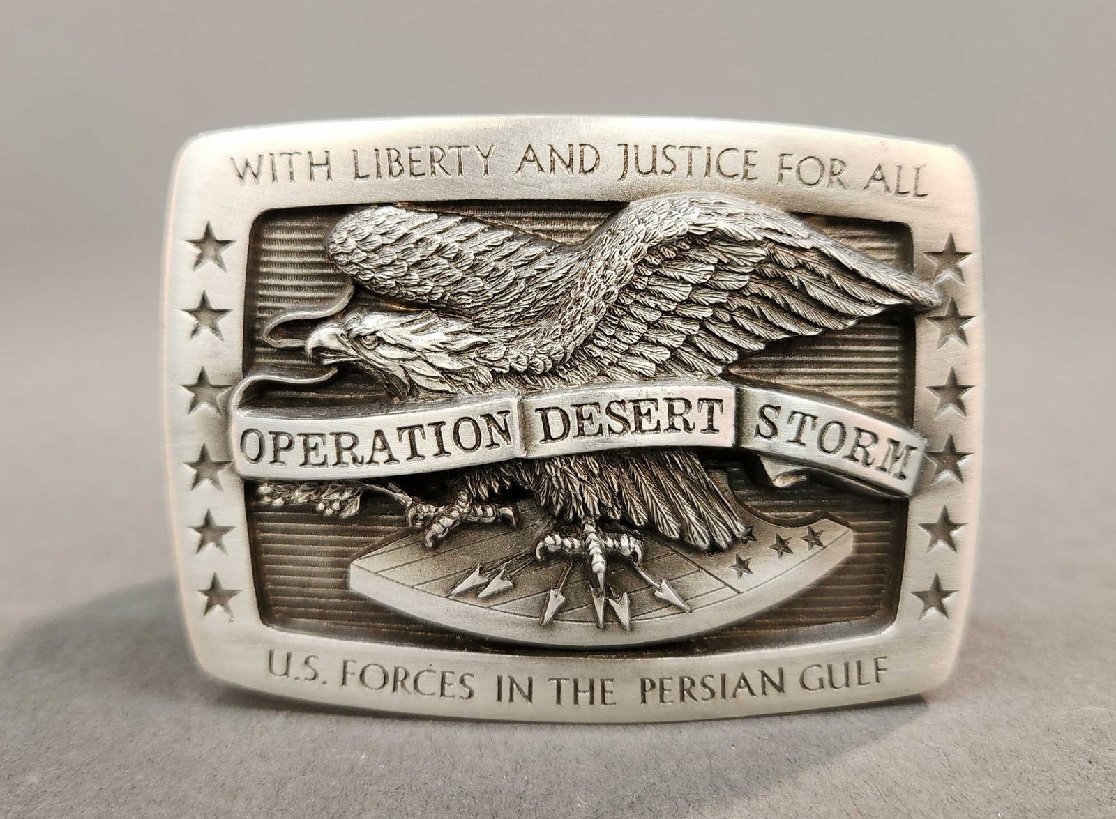 Gen. Gray Operation Desert Storm belt buckle: A General Alfred M. Gray Jr. Medallic Art Operation Desert Storm belt buckle. Sculpted by J.M. Calhoun. Engraved plaque on back "GENERAL/ ALFRED M. GRAY/ UNITED STATES MARINE CORPS." 3 1/4" x 2 1/4". 