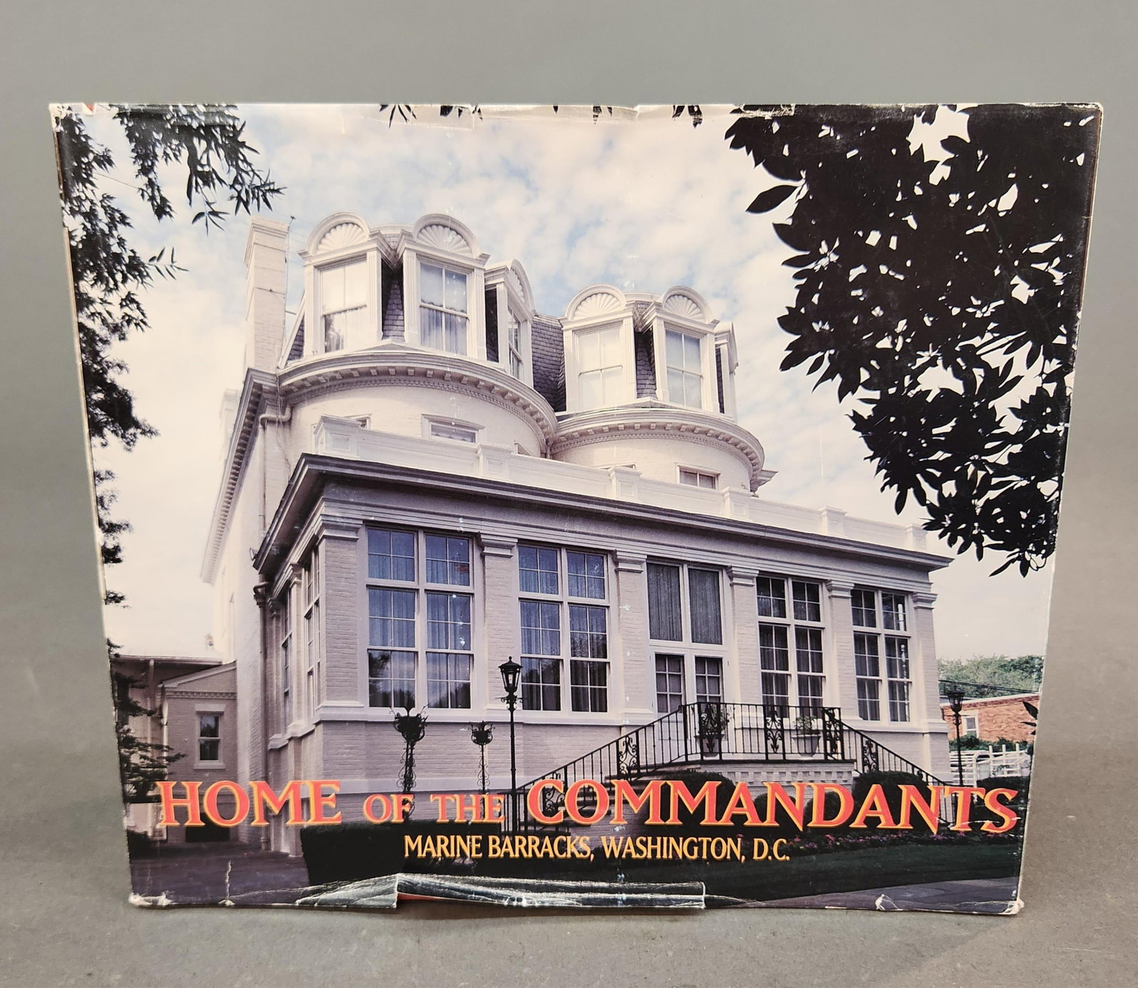 "Home of the Commandants" CADMUS, 1995: "Home of the Commandants" CADMUS Publishing Group, 1995. Embossed "LIBRARY OF ALFRED MASONGRAY" stamp on front flyleaf. 105 pages. Provenance: From the estate of U.S.M.C. Four Star General Alfred M. G