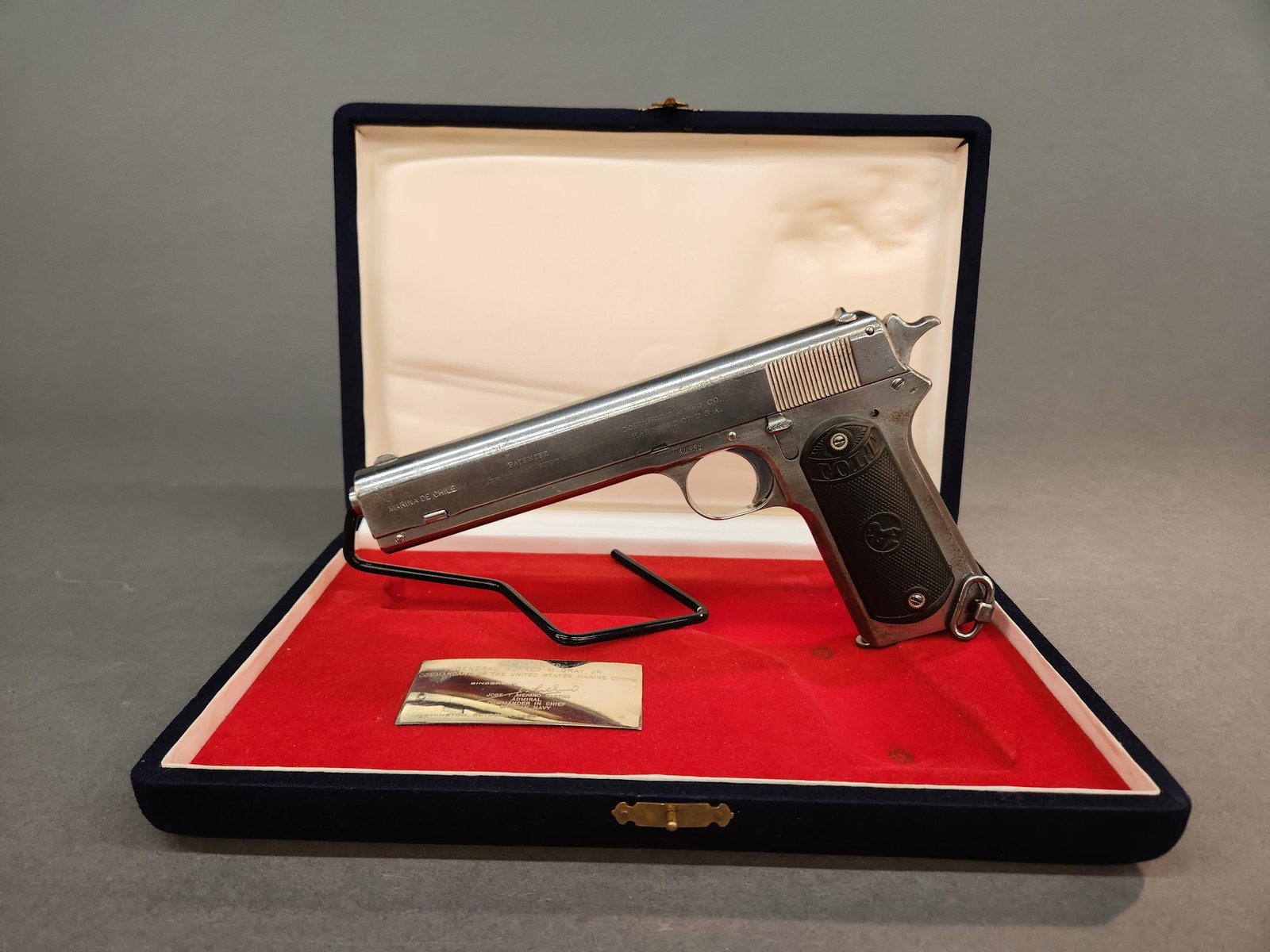Rare Chilean Navy Colt M1902 pistol, .38 ACP: A rare 1909 Chilean Navy marked Colt Model 1902 pistol, .38 ACP. Nickel finish. 6" barrel. Marked on slide "MARINA DE CHILE," 1897 and 1902 patent dates, and Colt address roll. Slide and frame marked 
