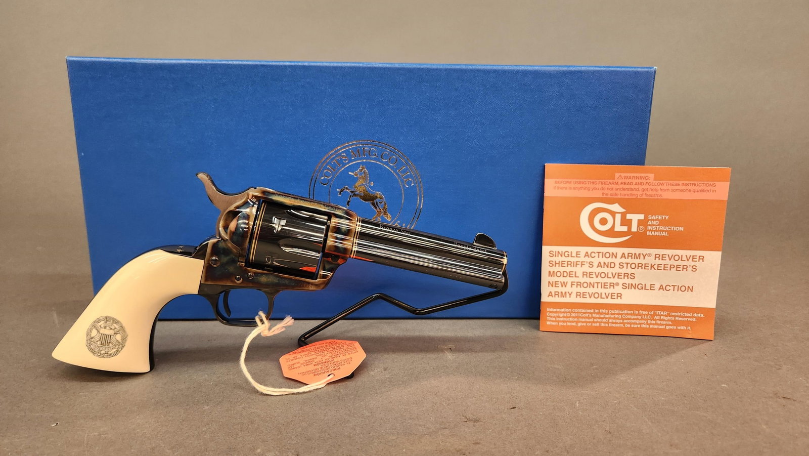 Gen. Gray Colt Custom SAA revolver, .45 LC: A 2011 Colt Custom engraved 3rd Generation Single Action Army single action revolver, .45 LC. Blued and case finish. 4 3/4" barrel. Custom engraved with scroll work around gold U.S.M.C. emblem, gold b