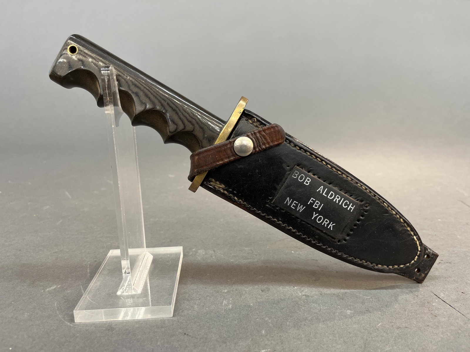 Bob Aldrich FBI Randall M14 Attack knife: A Robert "Bob" C. Aldrich FBI Randall made knife Model 14 Attack fixed blade knife with sheath. 7 1/4 clip point blade with maker mark and "BOB ALDRICH." Micarta finger grip handle. Leather scabbard w