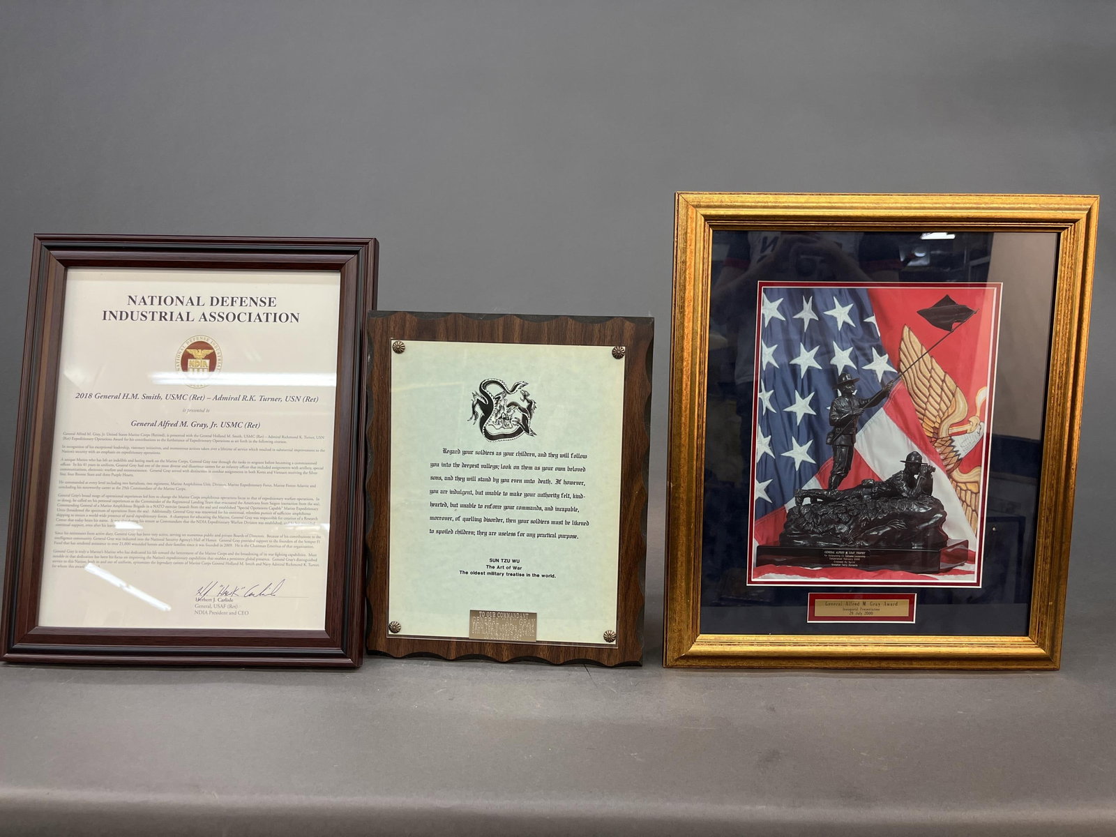 3 Gen. Gray commemorations.: A group of three documents and photographs commemorating General Alfred M. Gray Jr. from the Warriors of the 6th Marine Corps District, the National Defense Industrial Association, and the inaugural p