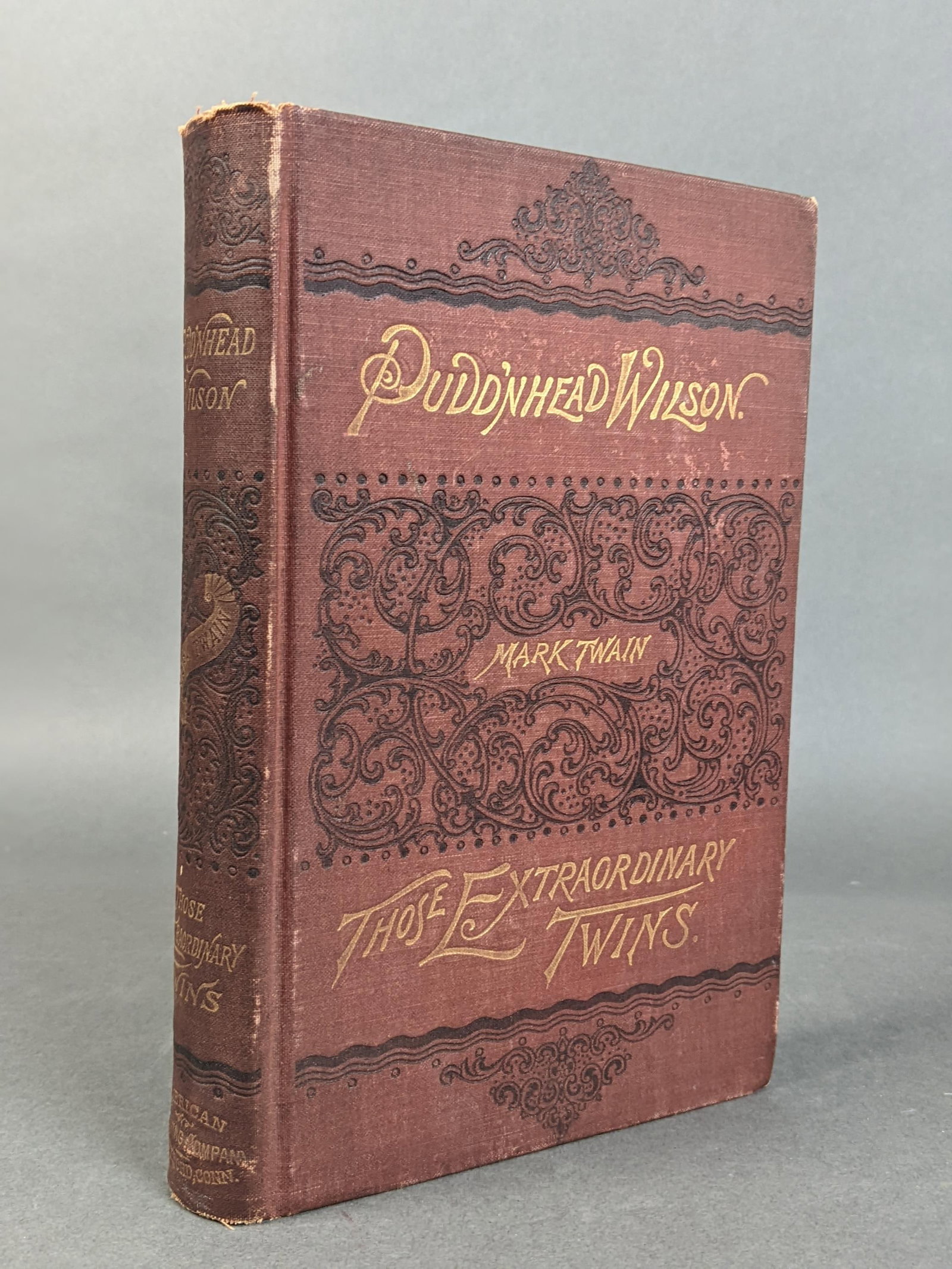 The Tragedy of Pudd?nhead Wilson.: [Literature] Twain, Mark. The Tragedy of Pudd?nhead Wilson. American Publishing Company, Hartford, 1894. First edition, first state. 8vo. Original brick red pictorial cloth, gilt. BAL 3442. Condition: