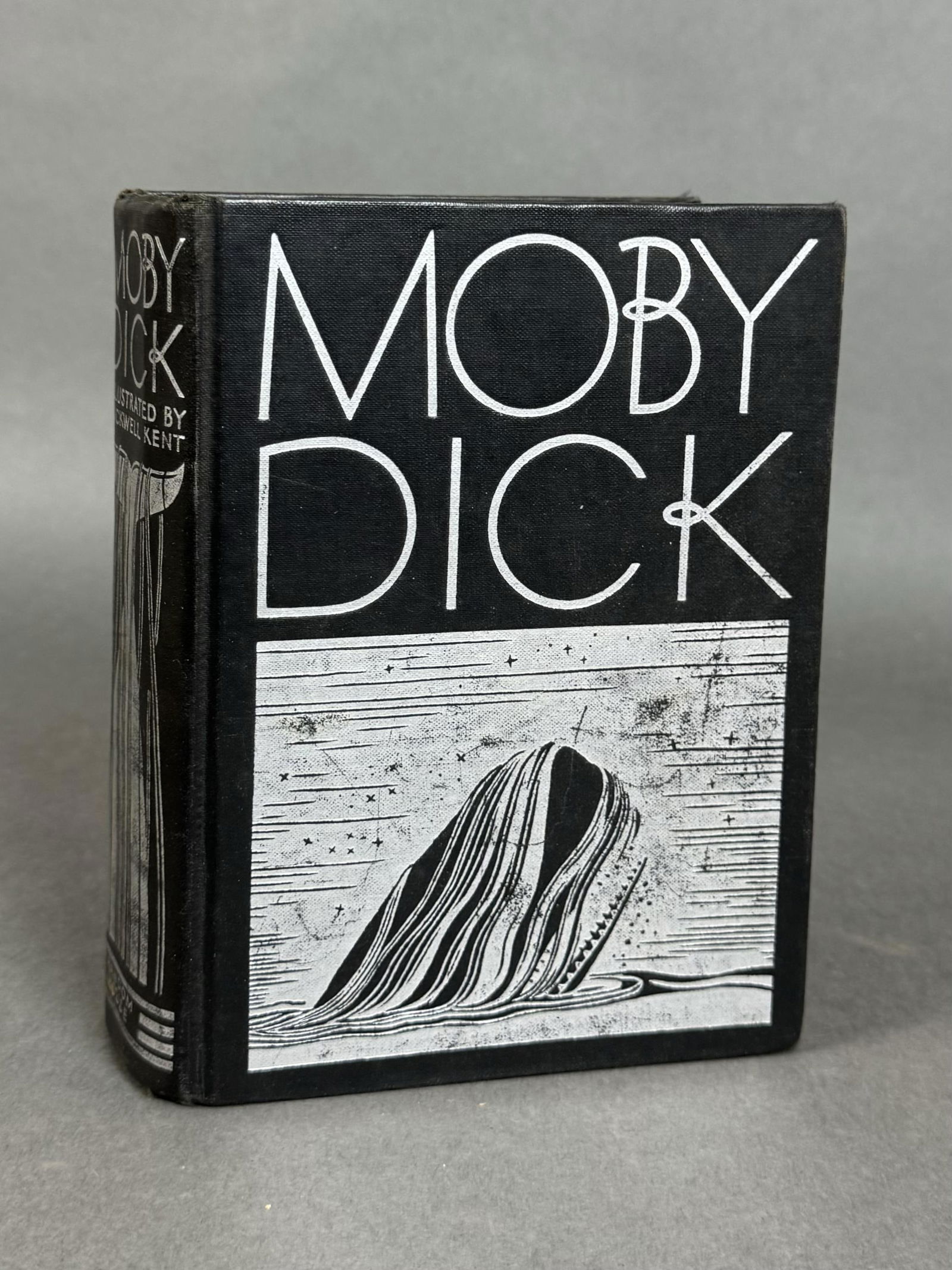 Moby Dick.: [Literature] Melville, Herman. Moby Dick. Random House, New York. 1930. Illustrated profusely by Rockwell Kent. 8vo. xxix, (1), 822, (4), pp. Publishers black cloth, silver design and title on cover a
