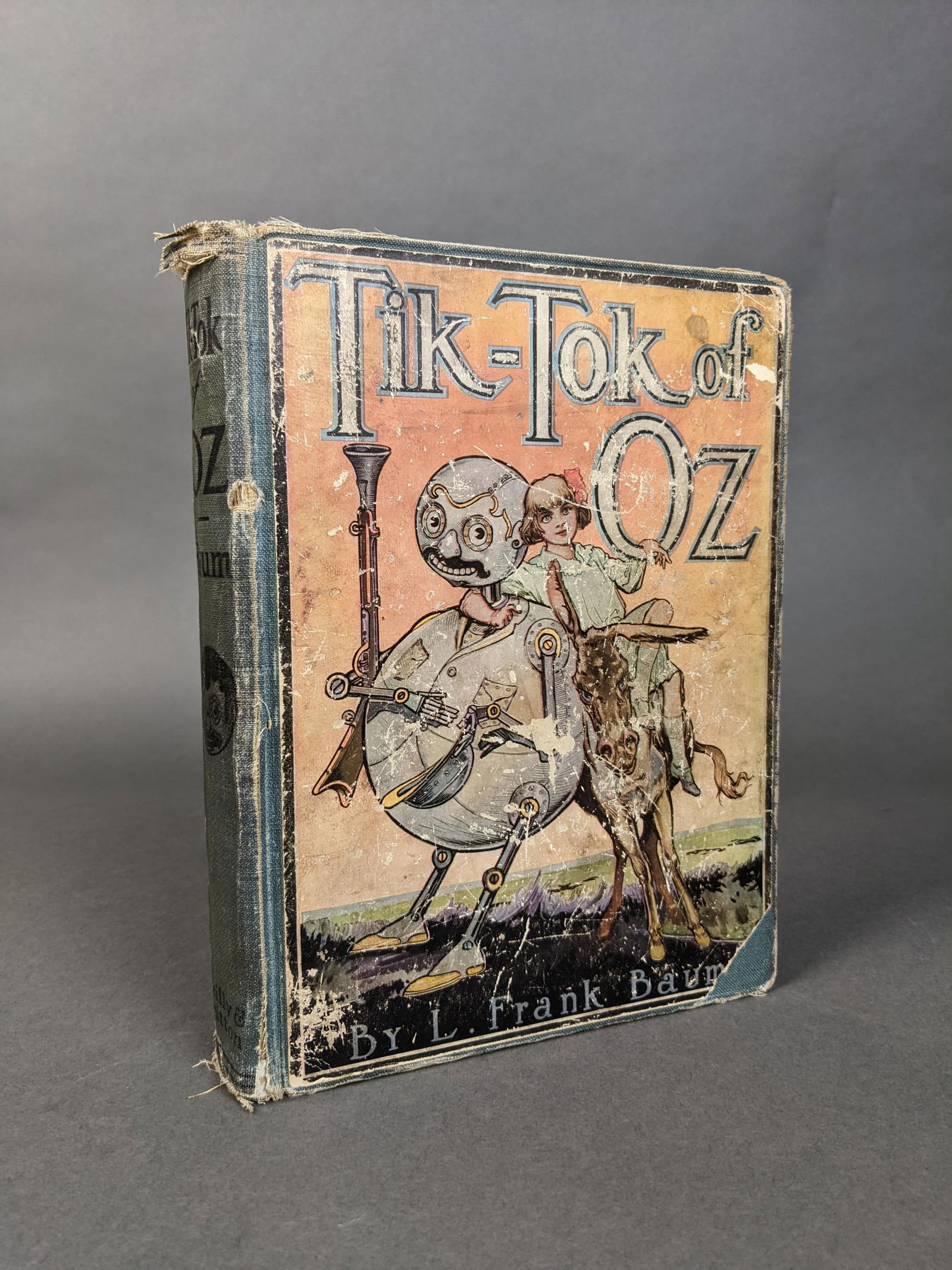 Tik-Tok of Oz: [Childrens] Baum, L. Frank. 271, Tiz-Tok of Oz. The Reilly & Britton Co., Chicago, 1914. First edtion and First state with advertisements on verso of half-title listing 6 titles through The Patchwork