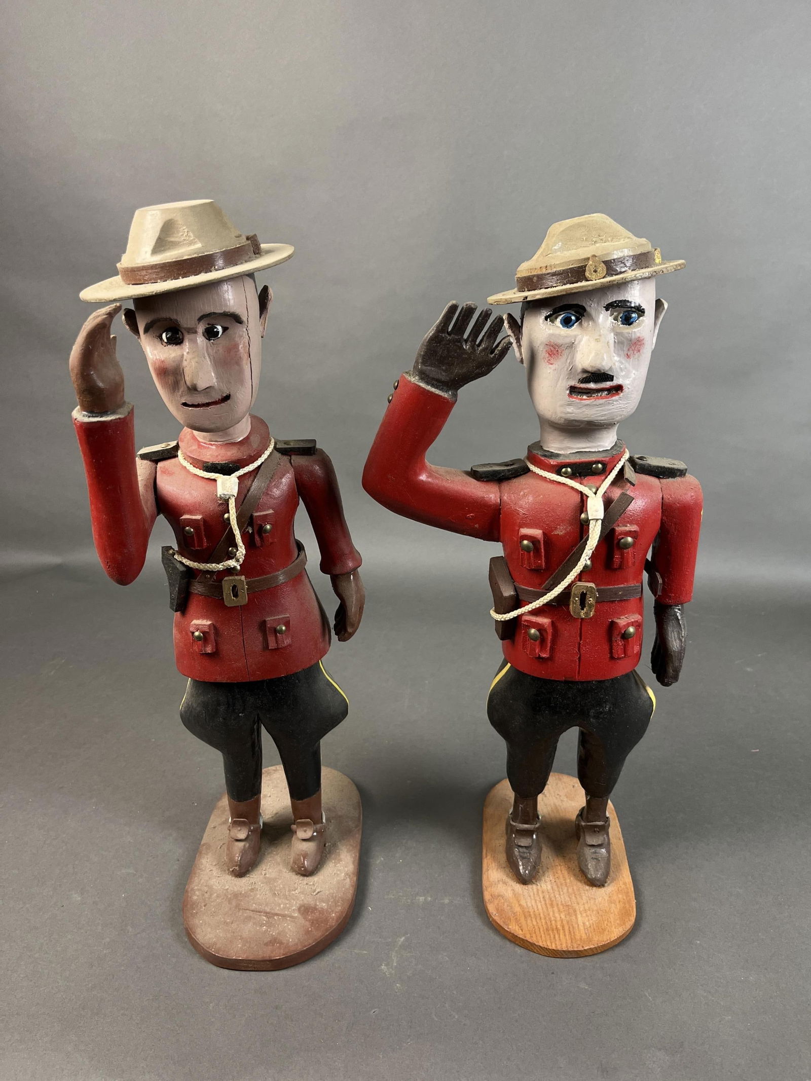 2 Folk Art Canadian Mounties. (1 of 4)