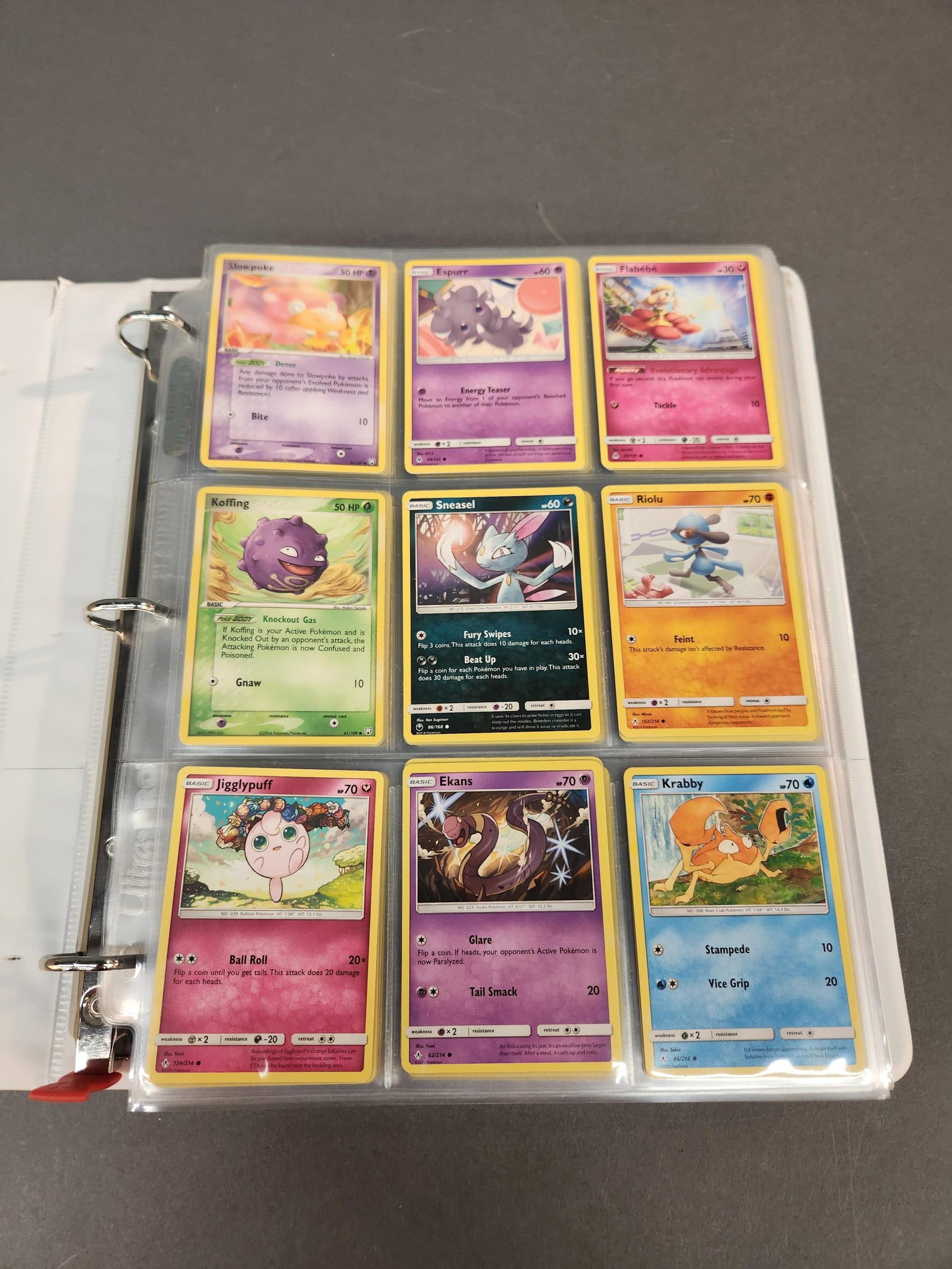 Binder of Pokemon cards: A binder of 171 Pokemon cards, 1999-2020. Including #150 "Dragonair" (Reverse Holo) Unified Minds, #55 "Ekans" (Reverse Holo) Team Rocket Returns, and #13 "Pinsir" Hidden Legends.