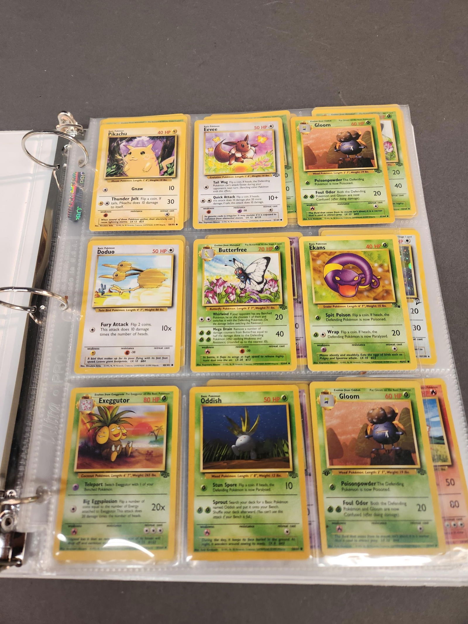 Binder of early Pokemon cards: A binder of 144 Pokemon 1st Edition, 2nd Edition, Base Set, Fossil, Jungle cards, and Team Rocket. ++ Including #21 "Kangaskhan" (1st Edition) Jungle, #23 "Hypno" (1st Edition) Fossil, #45 "Rhydon" (1