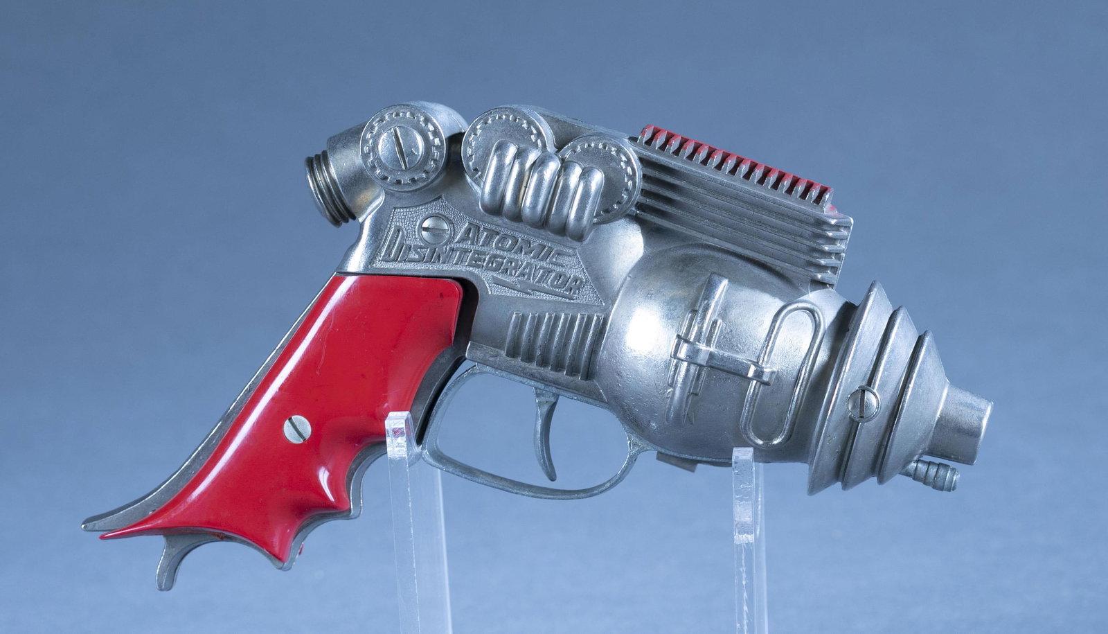 Hubley Atomic Disintegrator cap gun: A Hubley Atomic Disintegrator cap gun. 6 1/2" x 5" x 2" Condition: Warping on plastic grips. Working condition.