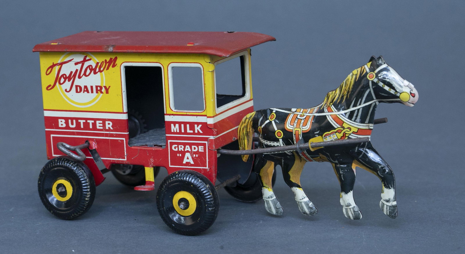 Marx "Toytown Dairy" tin litho wind up wagon: A Marx "Toytown Dairy" tin lithograph wind up wagon. 4 1/2" x 10" x 4" Condition: Working condition. Light wear.