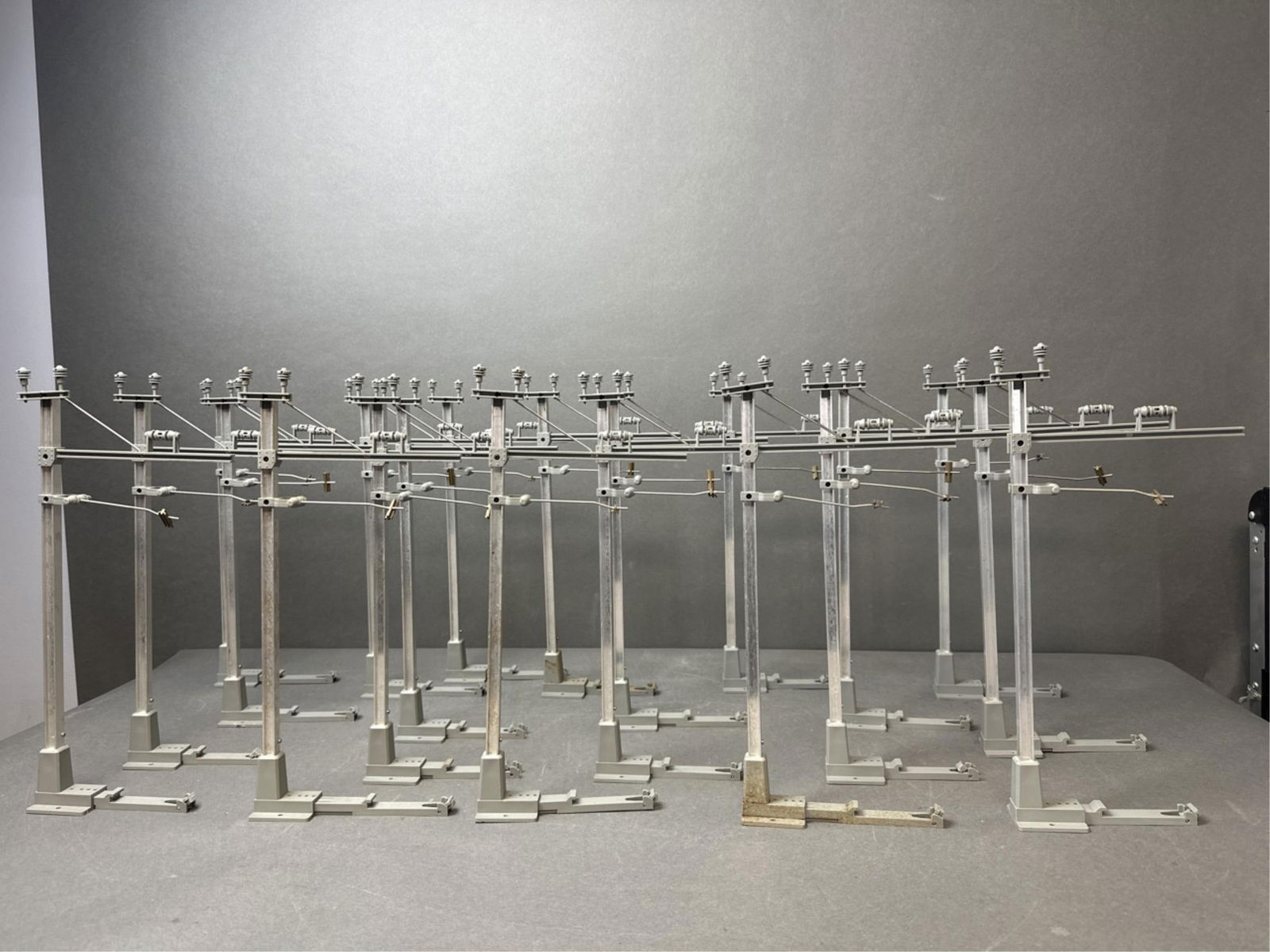 20 LGB G Scale No. 5630 Catenary Masts: A group of twenty LGB G Scale No. 5630 Catenary Masts. 6" x 1 3/4" x 14" Condition: All pieces in this lot are complete; does not come with boxes