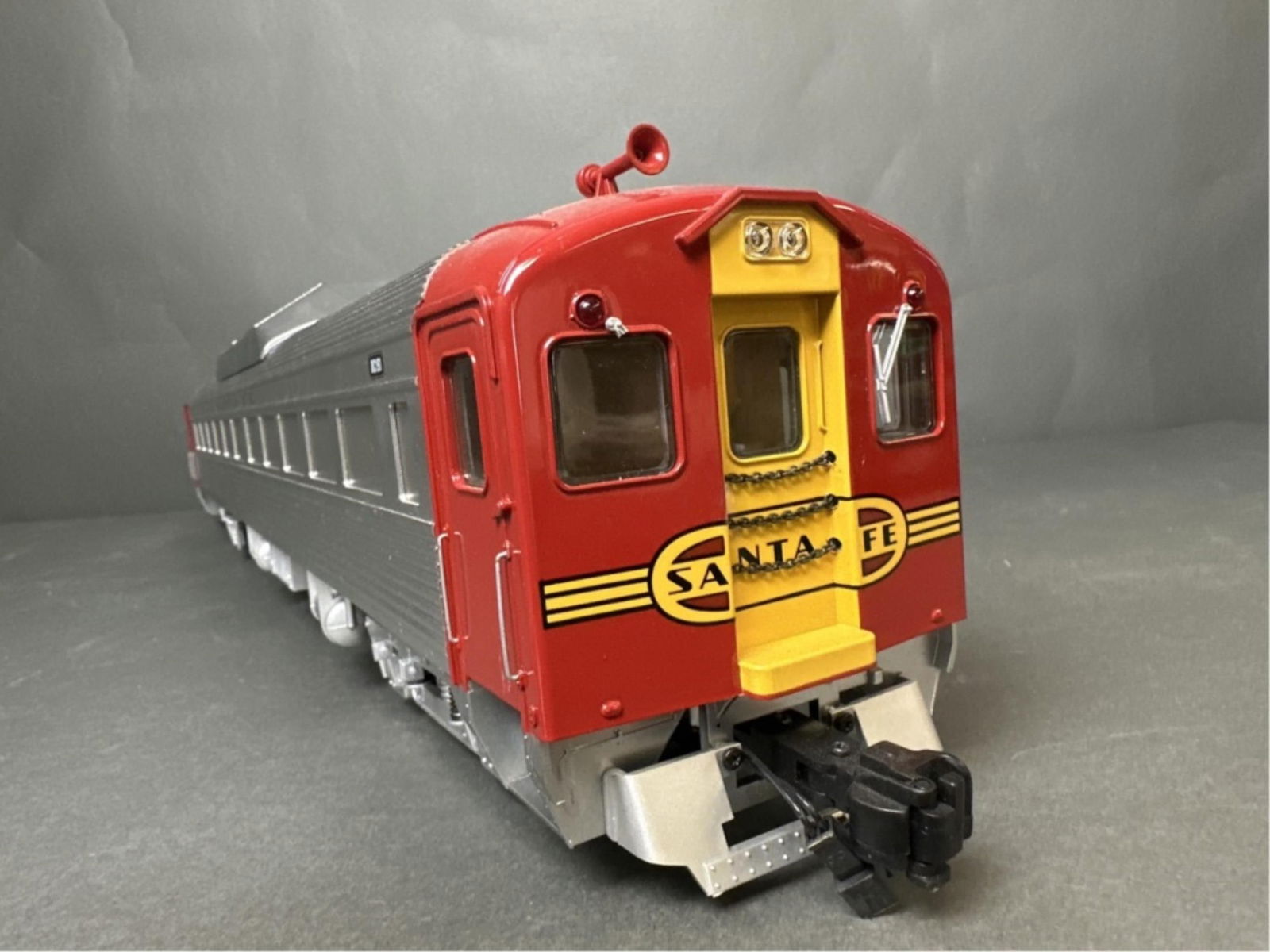 Aristo Craft G Scale ATSF Diesel Car.: An Aristo Craft Santa Fe No. 22810 Rail Diesel Car. 6 1/2" x 31" x 4" Condition: Appears to be missing a windshield and a window on a door