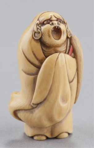 An ivory netsuke of Daruma.: By Mitsushige, Osaka, Mid 19th century. , Mid 19th century Standing with his mouth fully open in a monumental yawn revealing four irregularly spaced teeth. His eyes are inlaid with dark horn and his b