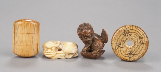 A group of four netsuke, various materials.: The first, late 18th century, in ivory, in the shape of a two-case inro, with cord channels on the sides and the lines that delineate the compartments. 1 3/4in (4.5cm). The second, 18th century, in iv