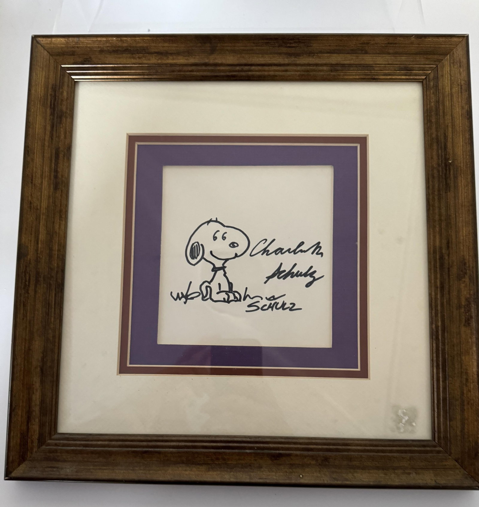 Charles Schulz Snoopy drawing in marker.: Charles Schulz (American, 1922-2000). Original marker on paper drawing depicting Snoopy. With "Schulz" and "Charles M. Schulz" autograph. Charles M. Schulz Museum label on reverse. Label affixed. Imag