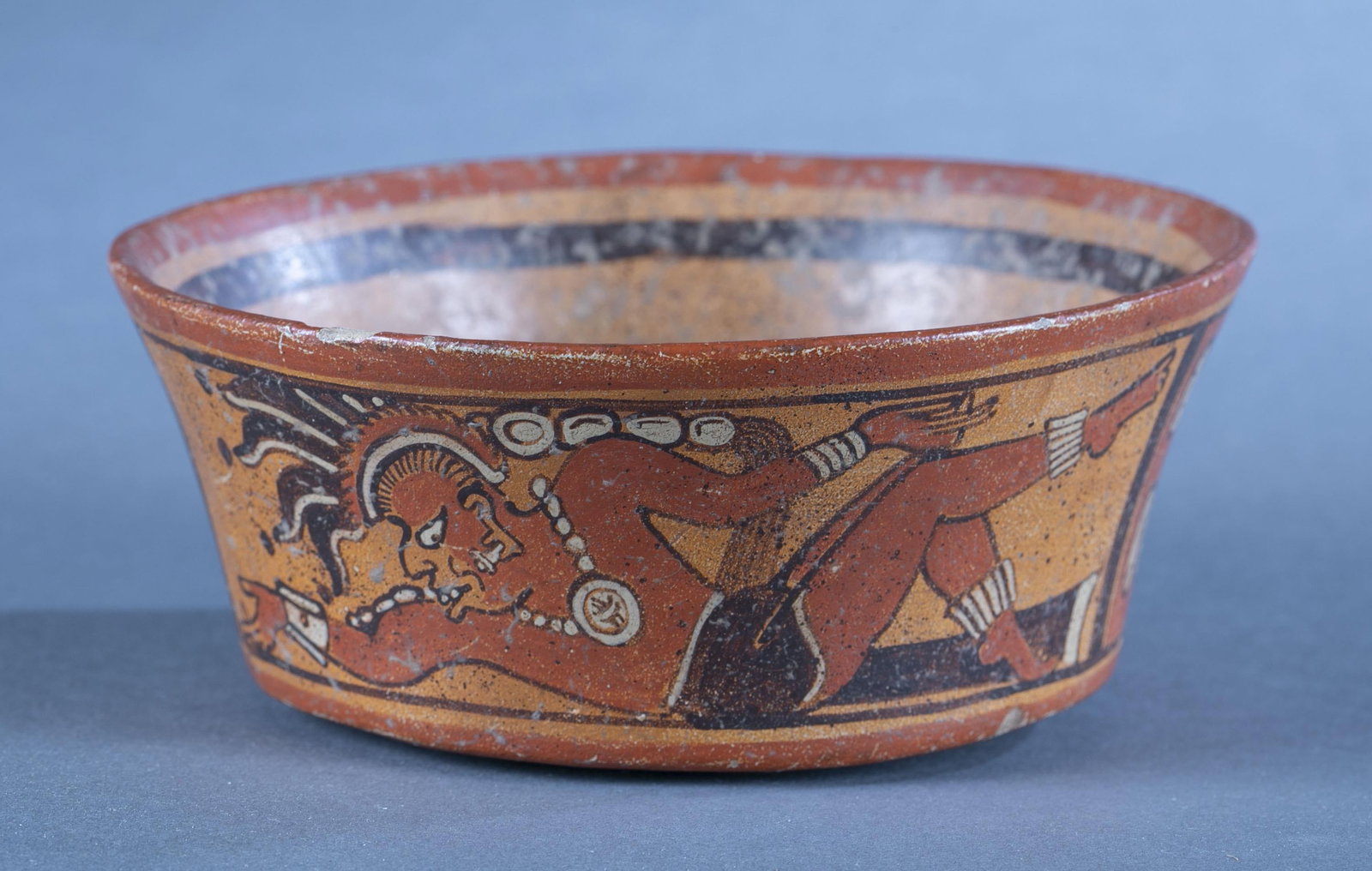 Mayan bowl, Guatemala.: A Mayan bowl decorated with figures and animals. Guatemala. 2 3/4" x 6 7/8". Condition: Abrasions. Provenance: From the collection of Kumiko Cross.
