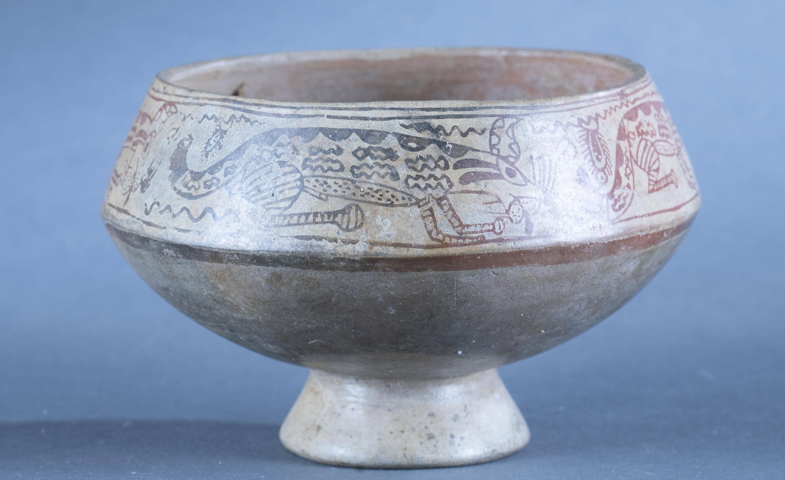 Moche bowl, Peru.: A Moche bowl with animal forms and geometric designs. Peru. 4 1/2" x 7". Condition: Abrasions and wear. Provenance: From the collection of Dale Spoor.