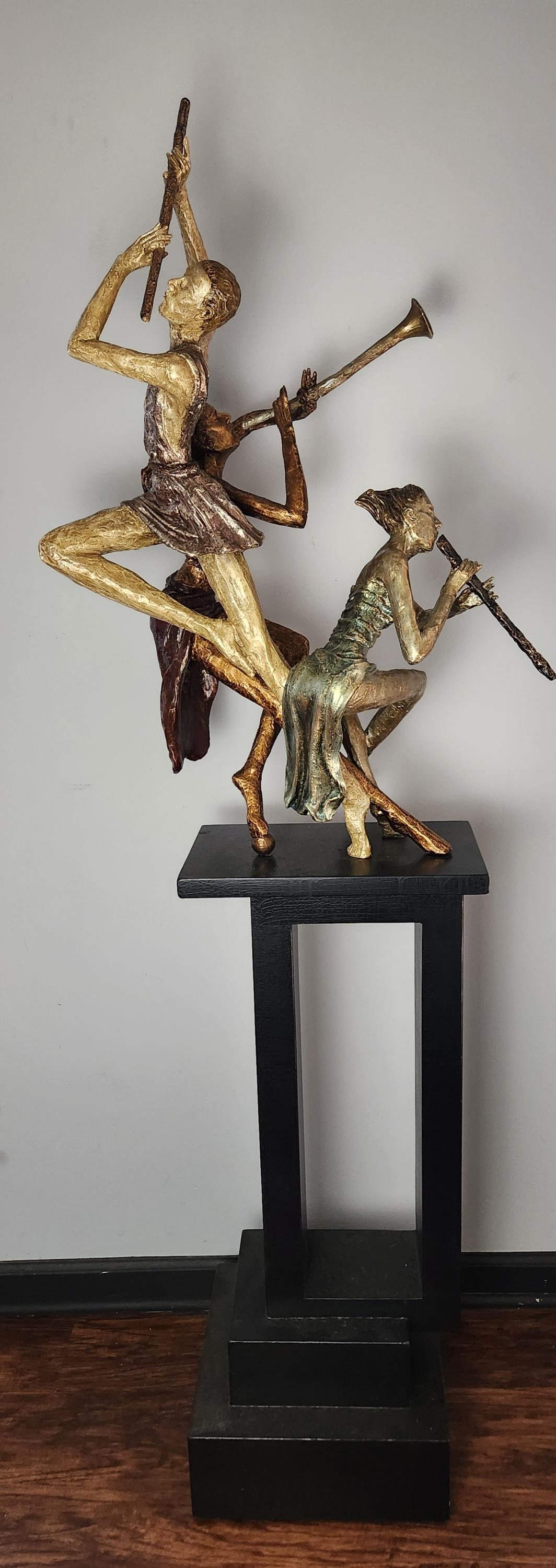 Musicians, Wood figural group on pedestal.: A musicians wood figural group in the style of Richard MacDonald on pedestal. Early 21st century. 69" x 24" x 14".