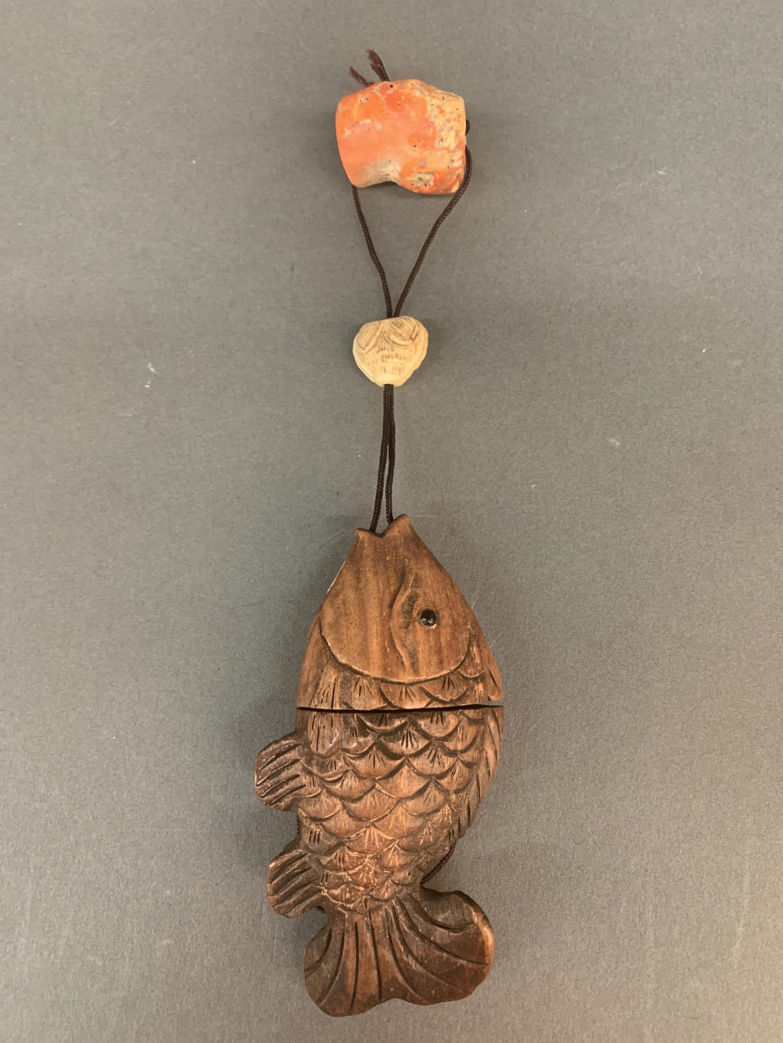 Japanese wood fish inro, ojime, and netsuke.: A Japanese wood fish inro, bone ojime, and coral netsuke. Fish signed. 9" overall. 4 1/2" x 2 1/4" x 1 1/8".